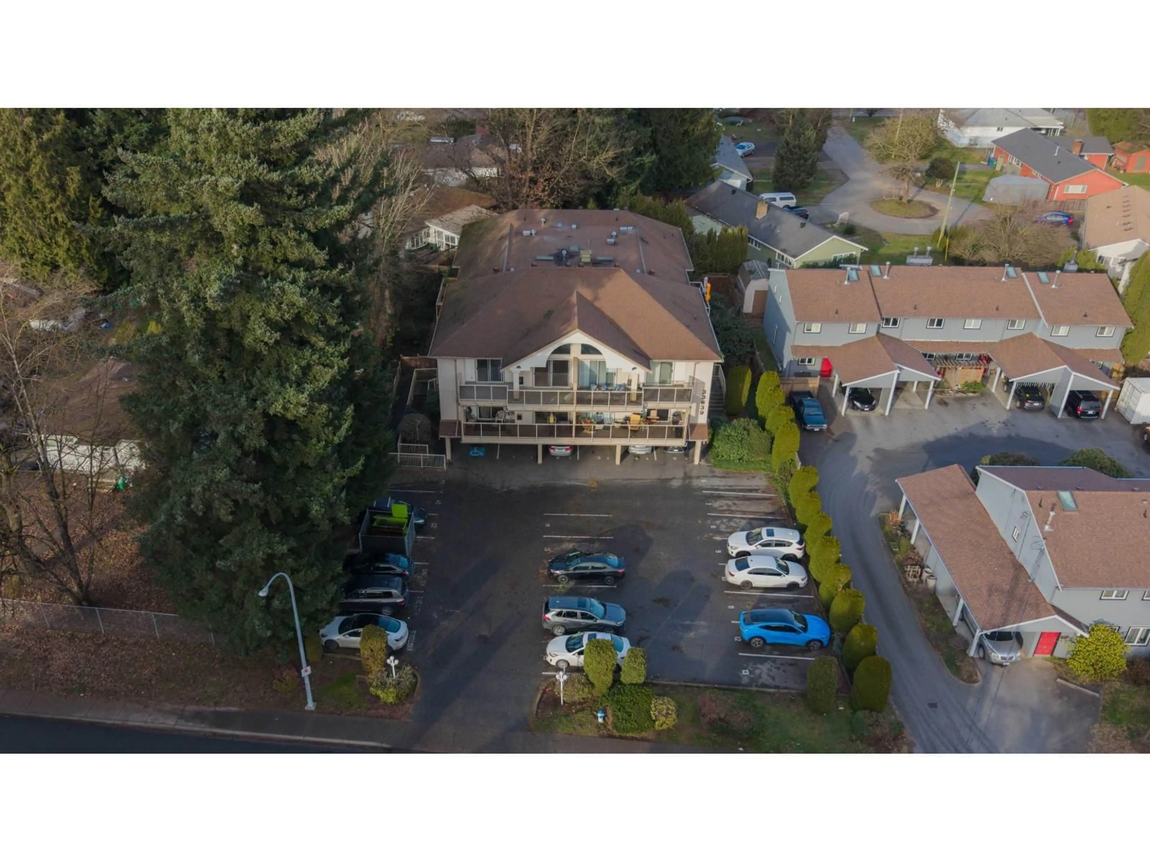 A pic from outside/outdoor area/front of a property/back of a property/a pic from drone, unknown for 305 - 33839 MARSHALL ROAD, Abbotsford British Columbia V2S1L6