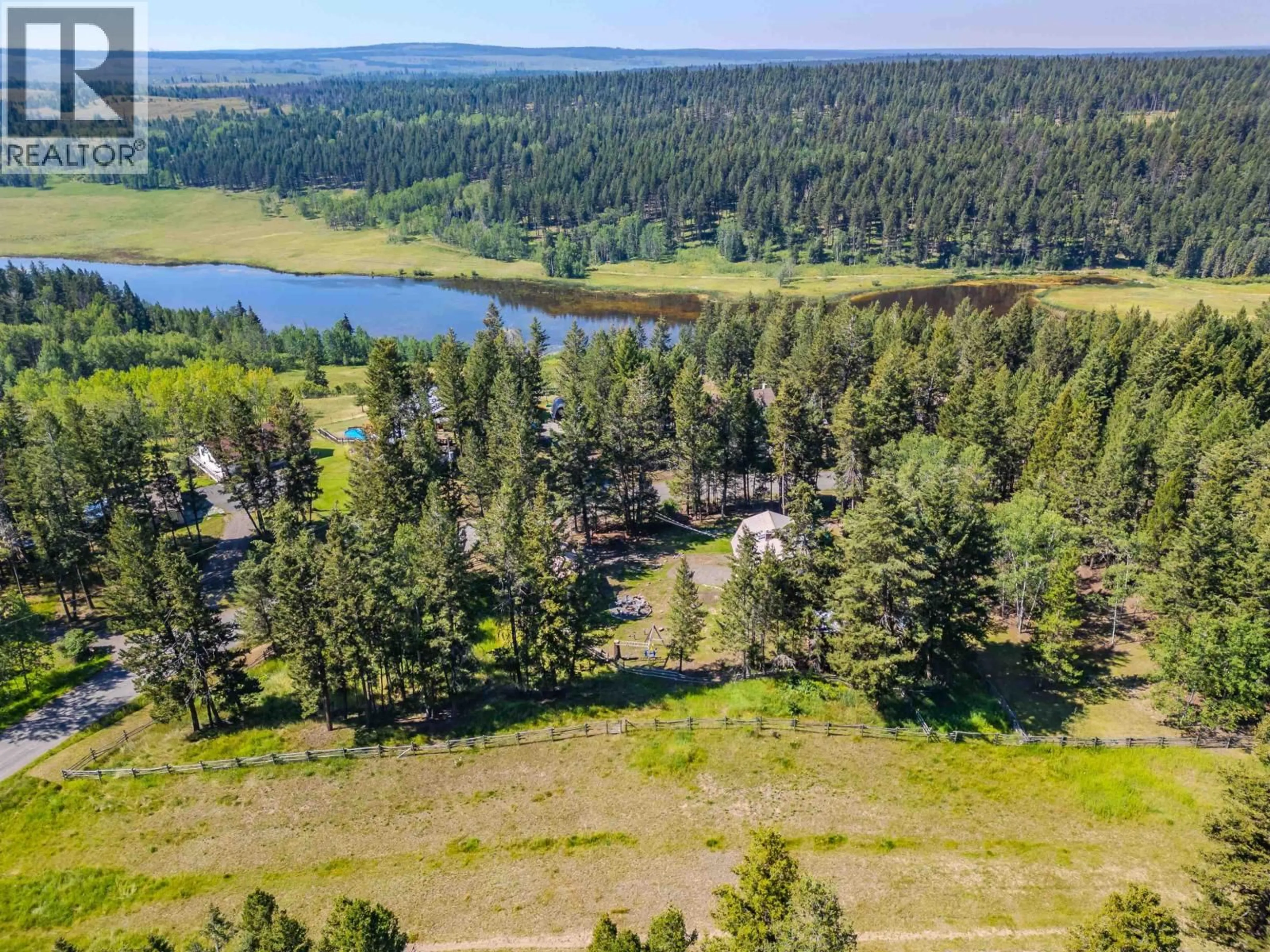 A pic from outside/outdoor area/front of a property/back of a property/a pic from drone, water/lake/river/ocean view for 4927 GLOINNZUN CRESCENT, 108 Mile Ranch British Columbia V0K2Z0