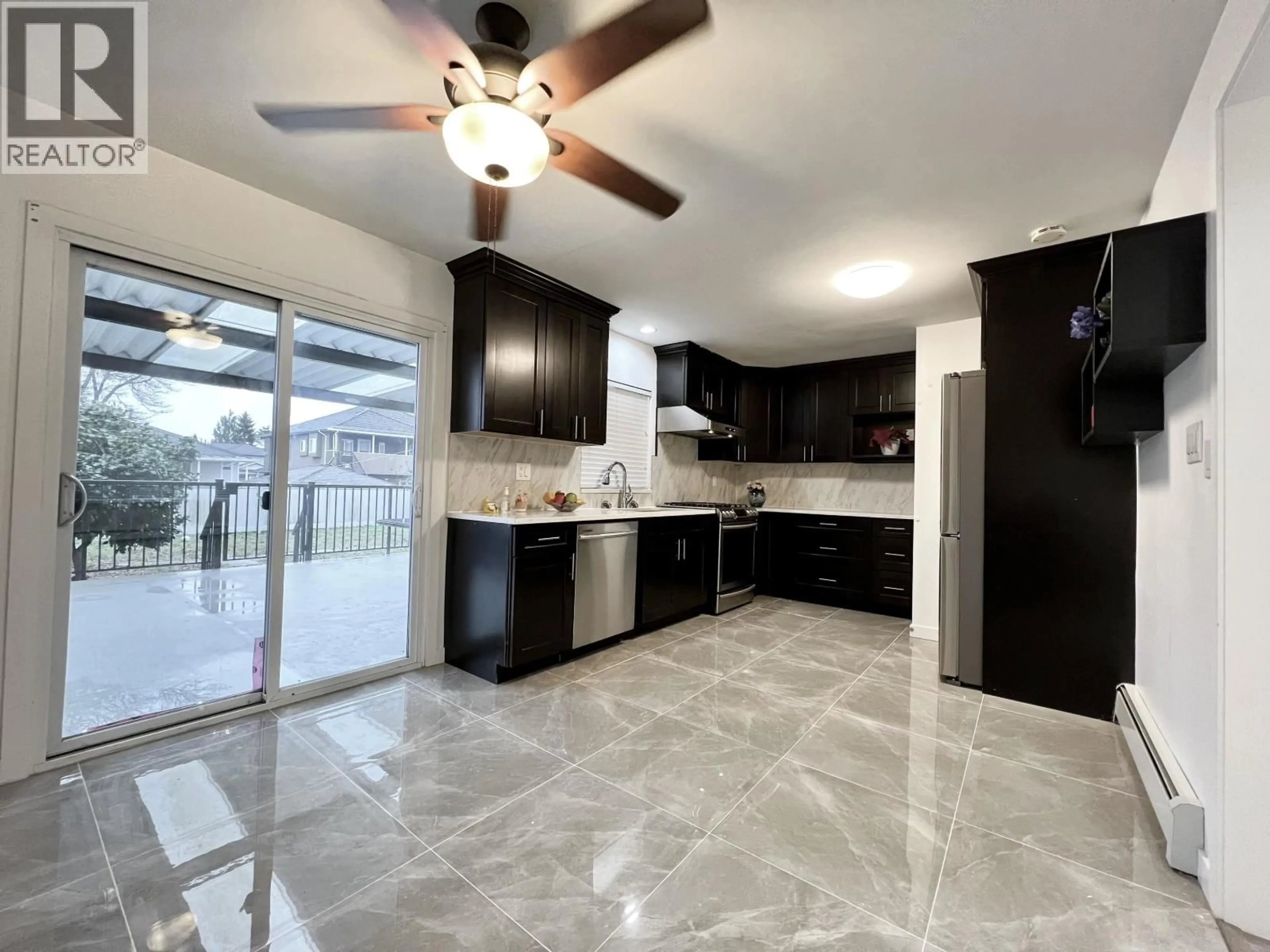 Open concept kitchen, ceramic/tile floor for 7768 18TH AVENUE, Burnaby British Columbia V3N1J2