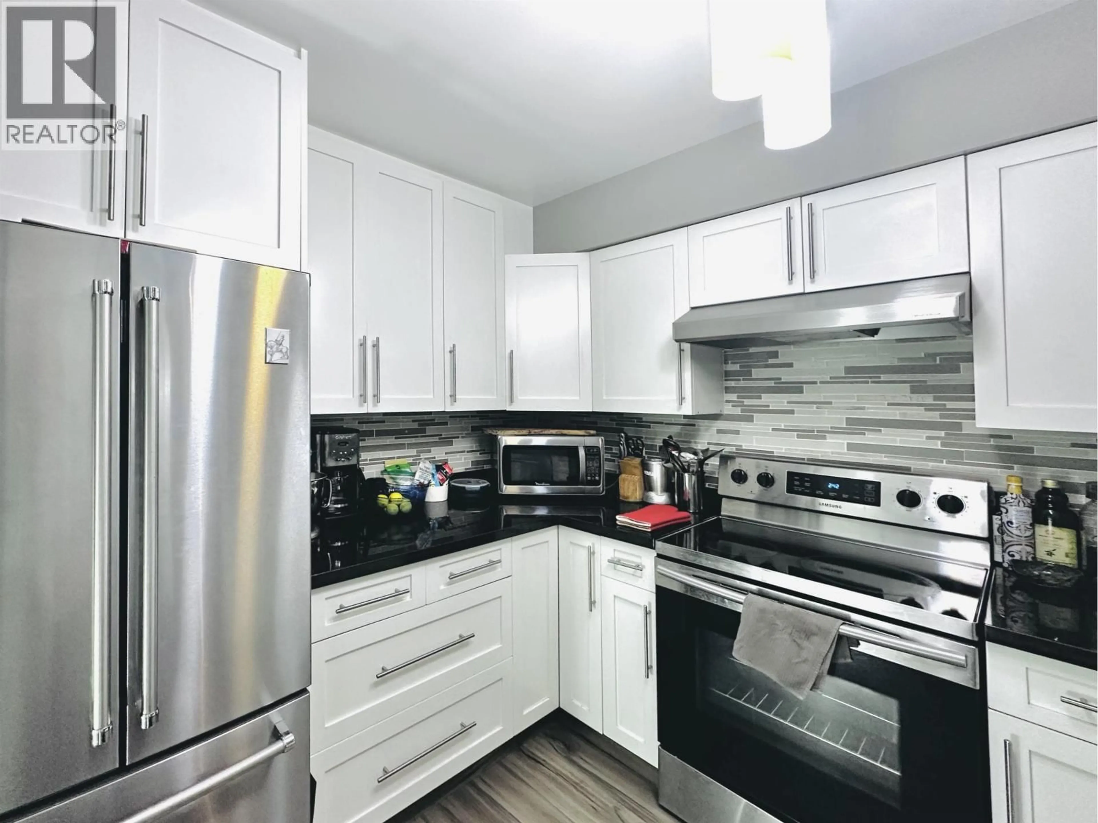 Contemporary kitchen, unknown for 203 - 650 MOBERLY ROAD, Vancouver British Columbia V5Z4J1