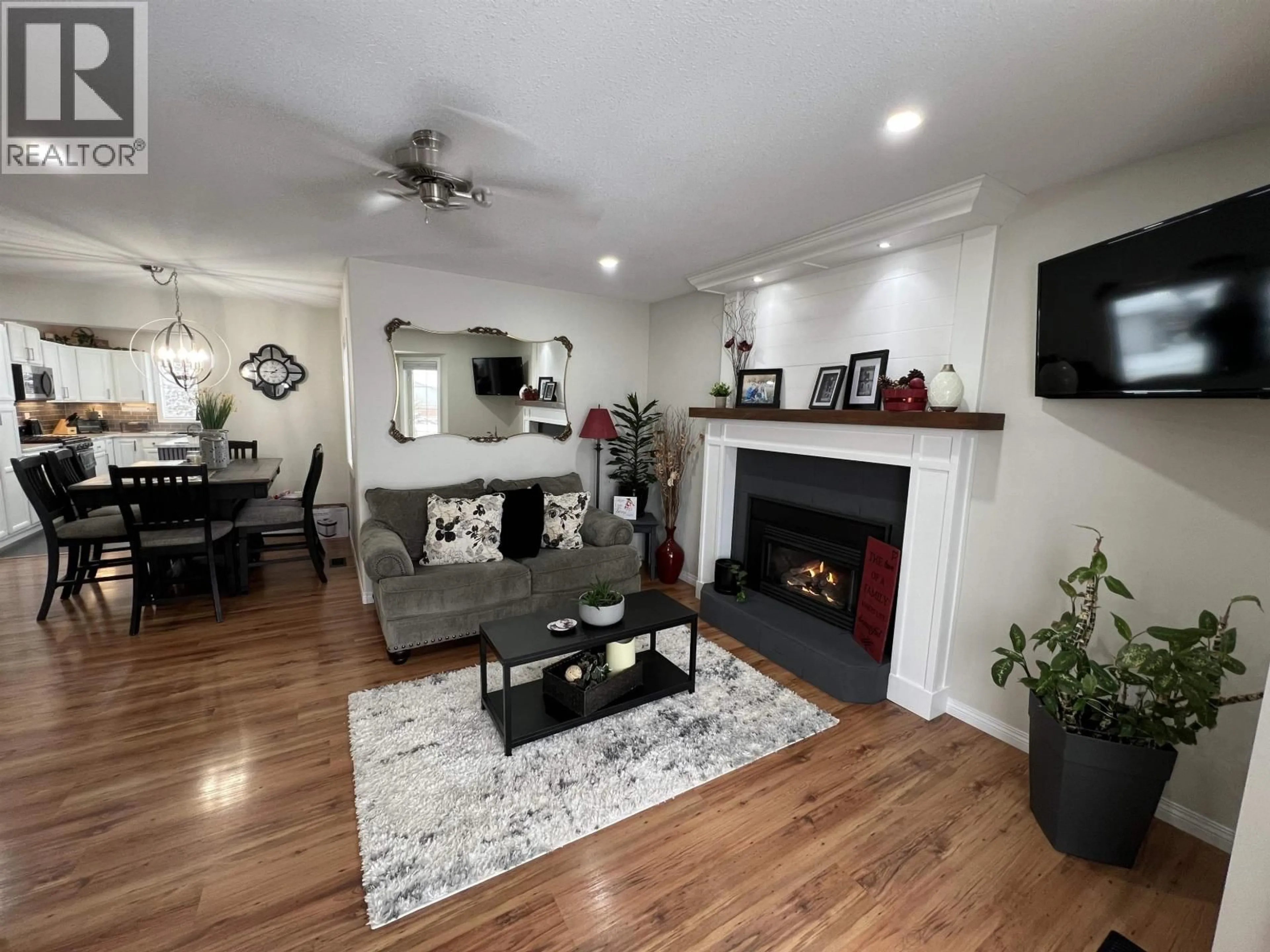 Living room with furniture, wood/laminate floor for 5517 57 AVENUE, Fort Nelson British Columbia V0C1R0