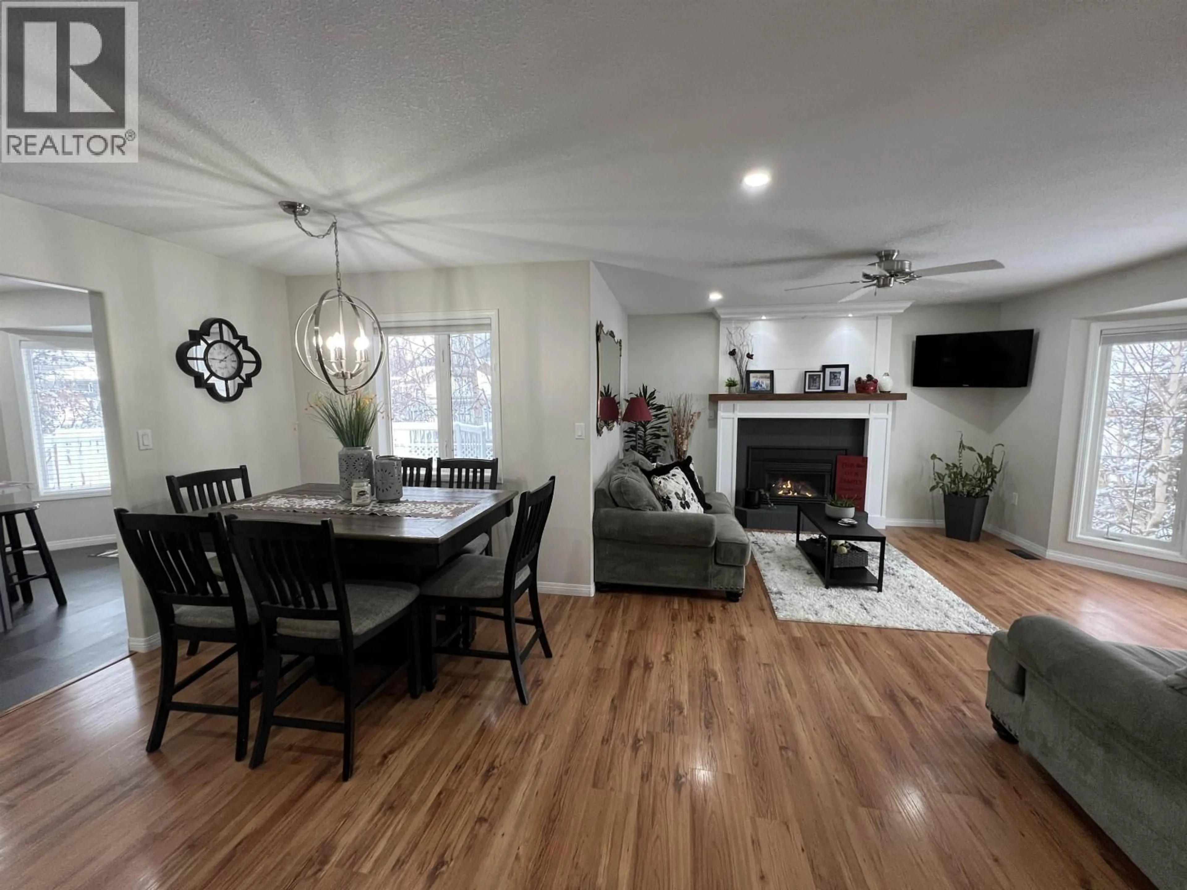 Living room with furniture, wood/laminate floor for 5517 57 AVENUE, Fort Nelson British Columbia V0C1R0