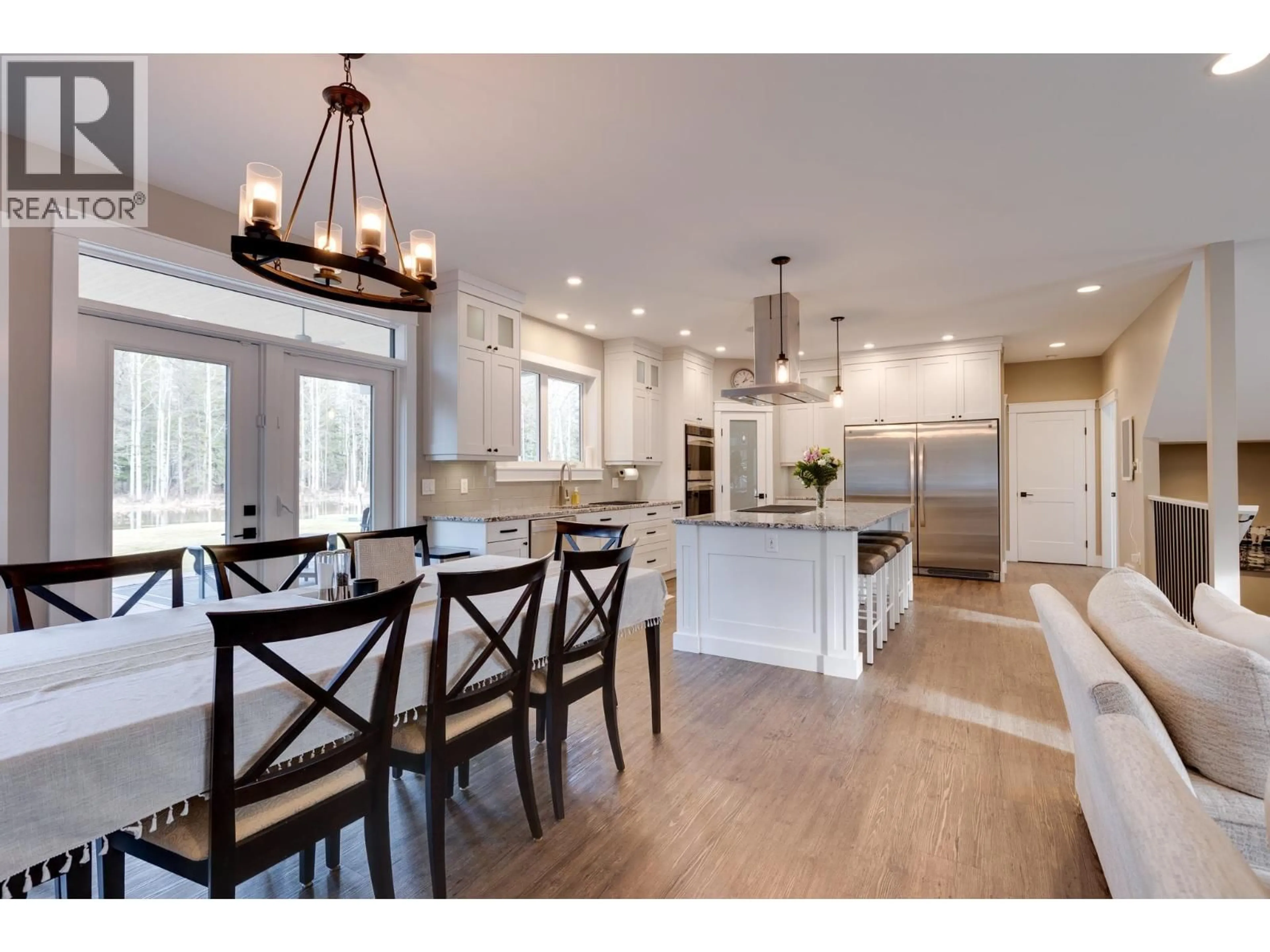 Open concept kitchen, wood/laminate floor for 3820 REEVES DRIVE, Prince George British Columbia V2N5Y2