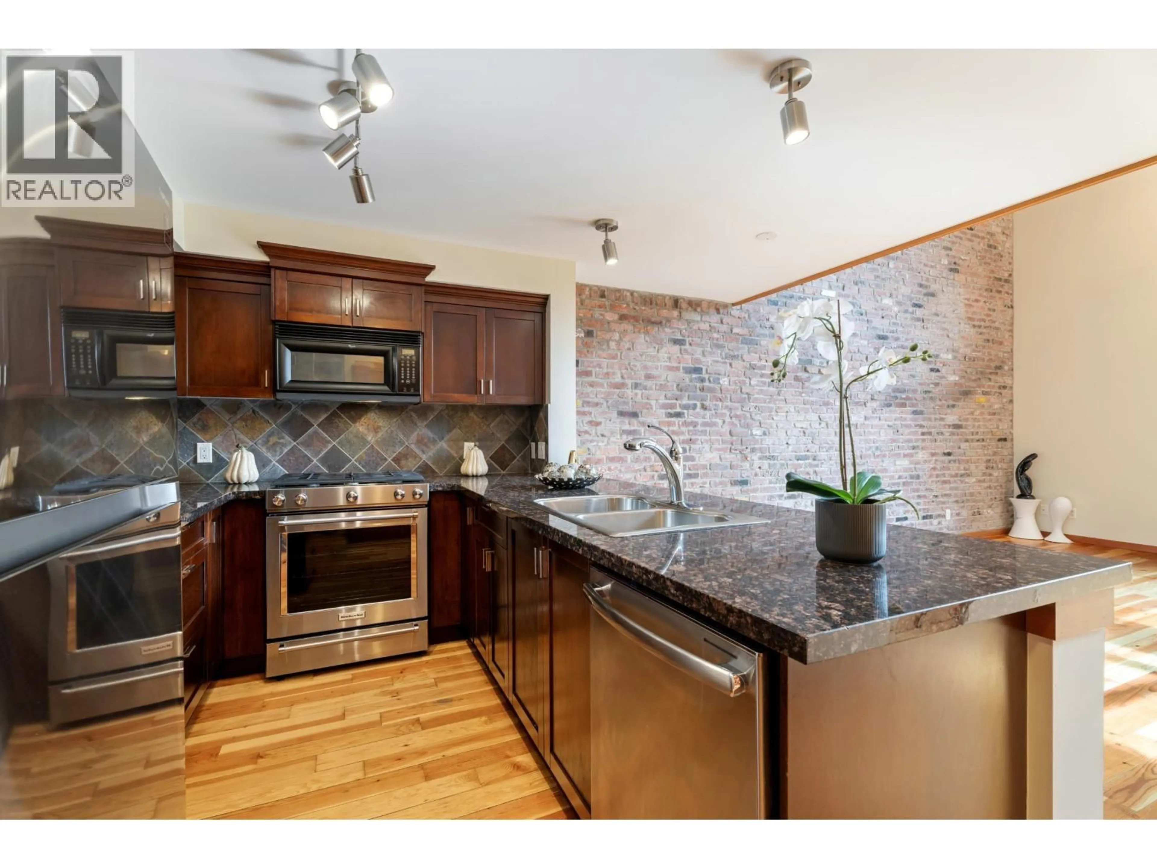 Open concept kitchen, ceramic/tile floor for 201 - 10 RENAISSANCE SQUARE, New Westminster British Columbia V3M7B1