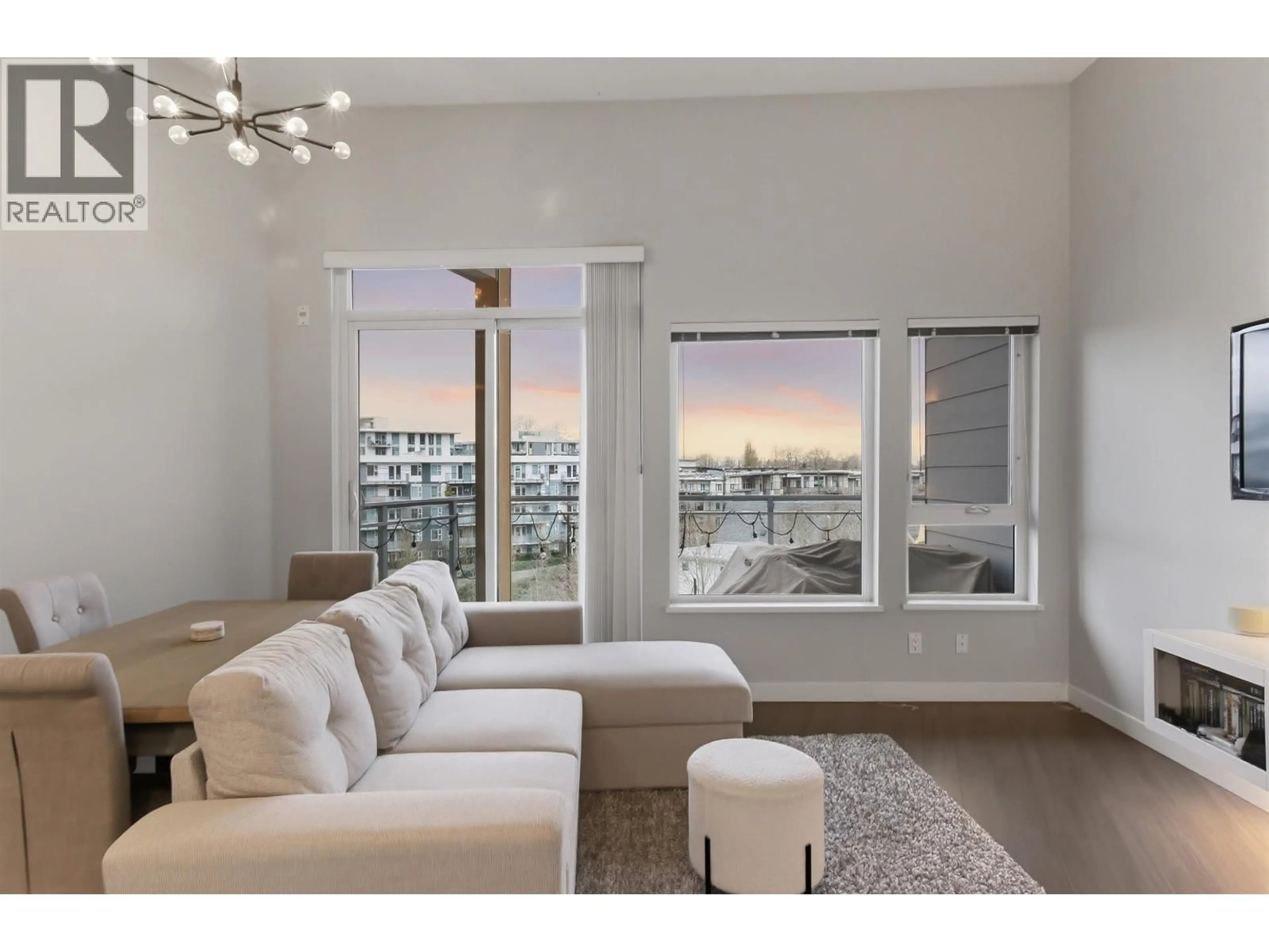 Living room with furniture, wood/laminate floor for 507 - 3263 PIERVIEW CRESCENT, Vancouver British Columbia V5S0C3