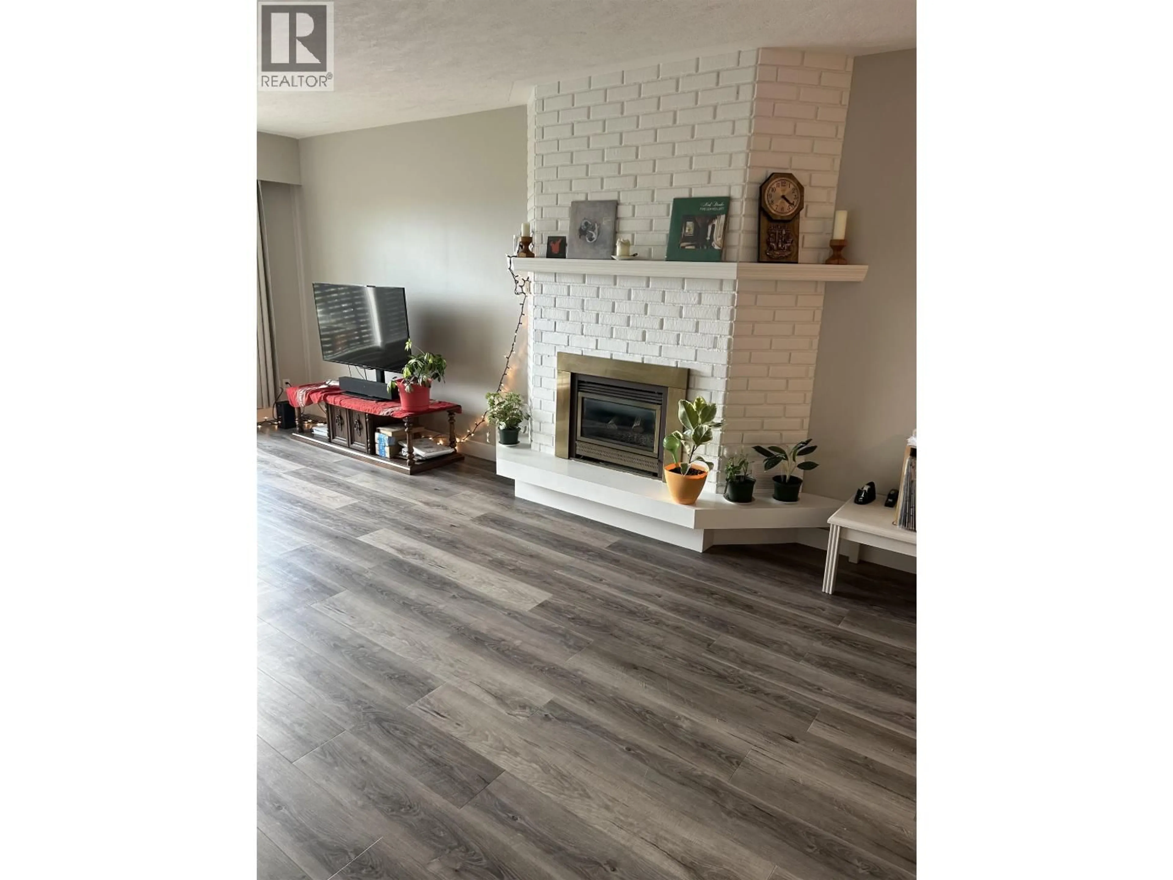 Living room with furniture, wood/laminate floor for 304 - 1654 10TH AVENUE, Prince George British Columbia V2L3S4