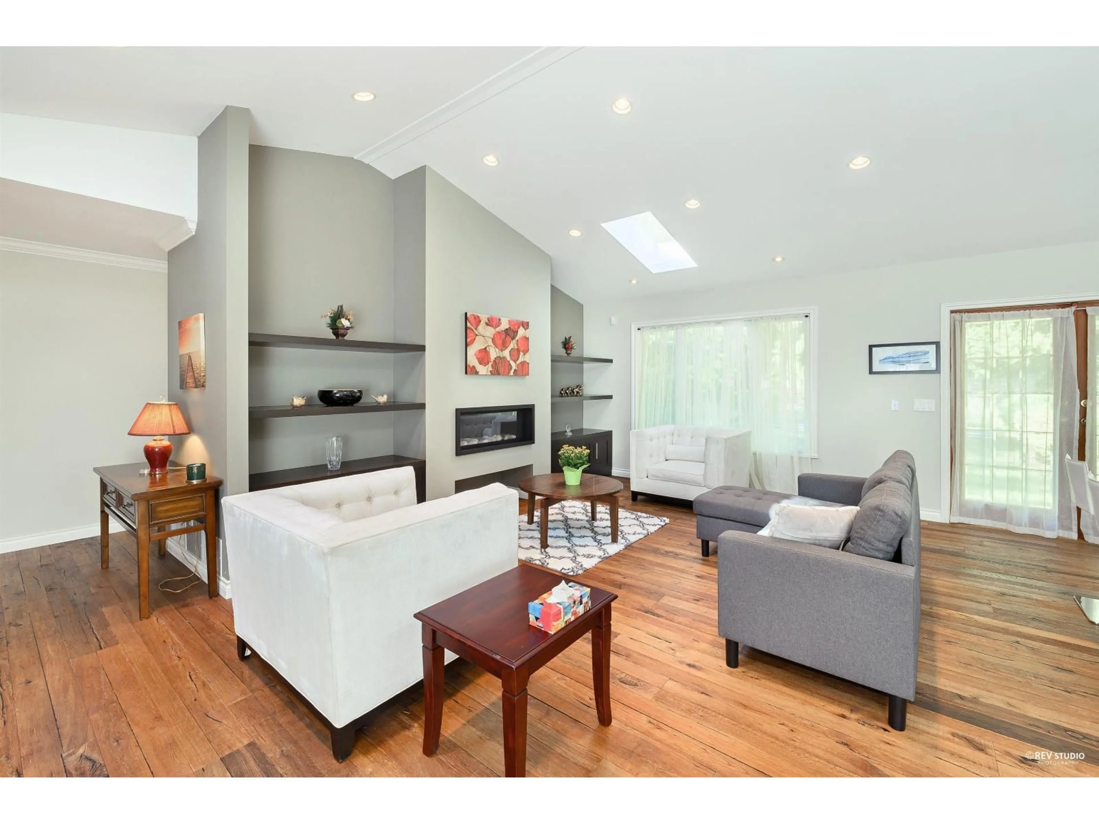 Living room with furniture, wood/laminate floor for 13671 16 AVENUE, Surrey British Columbia V4A1P7