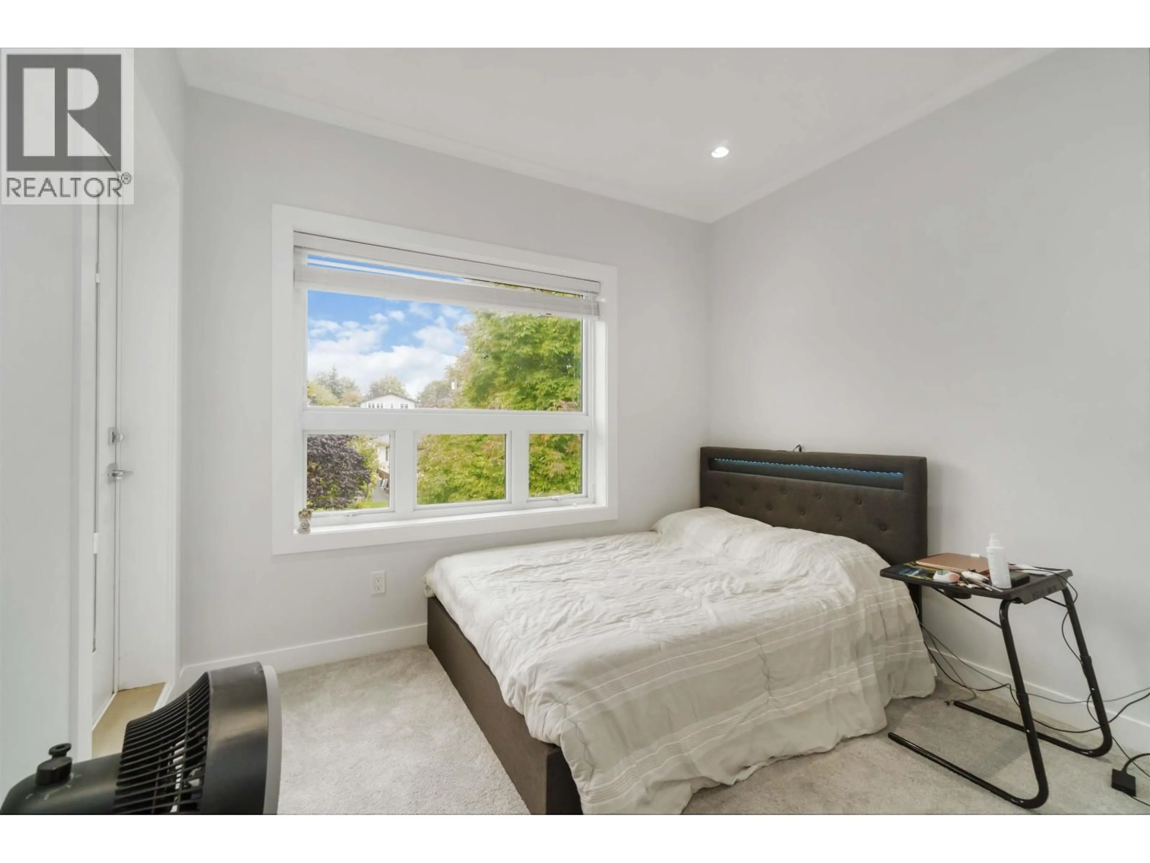 Bedroom with bed, wood/laminate floor for 2575 & - 2577 PARKER STREET, Vancouver British Columbia V5K2T2