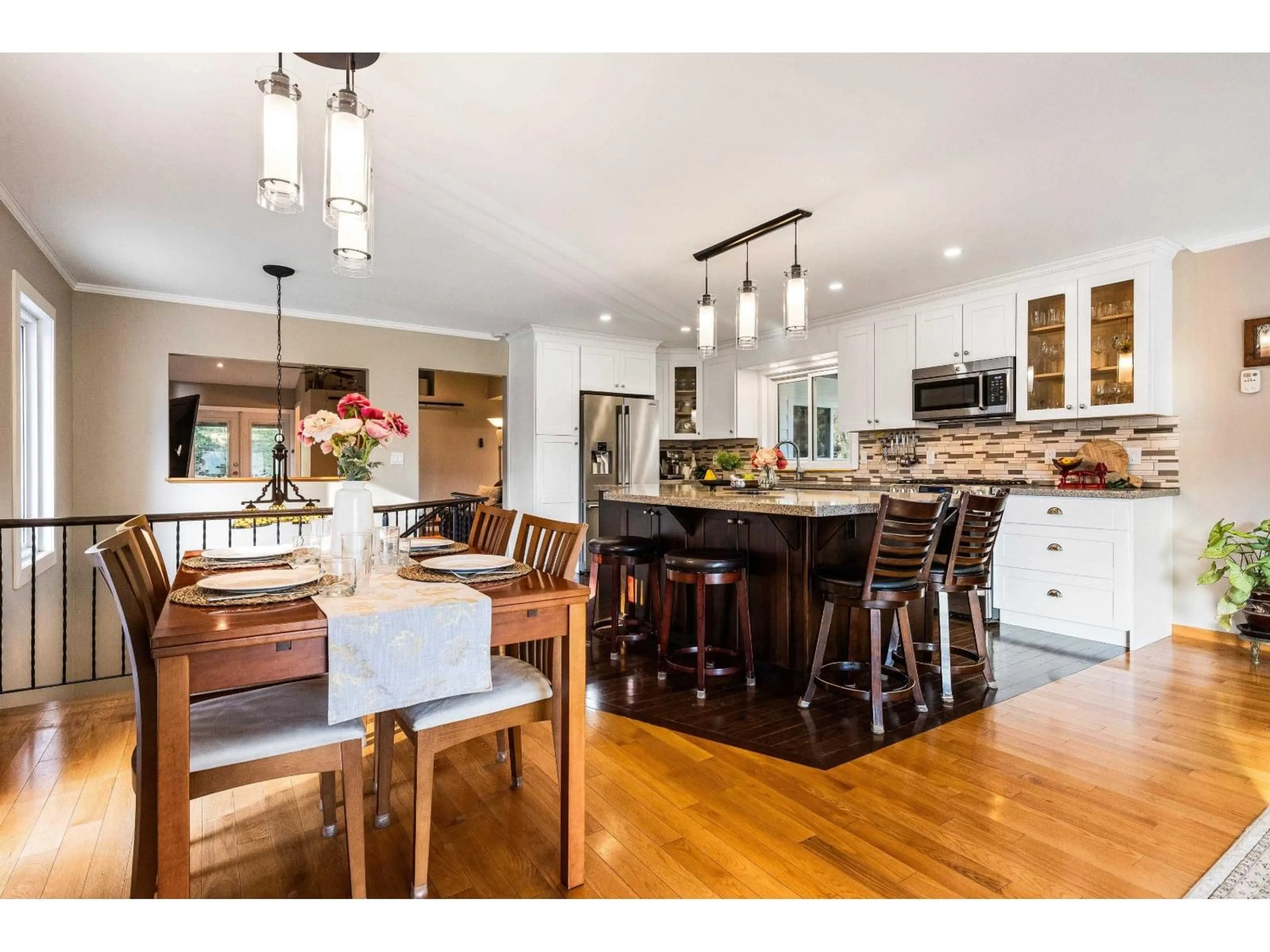 Open concept kitchen, wood/laminate floor for 4895 SOUTHSIDE ROAD, Chilliwack British Columbia V2R4T6