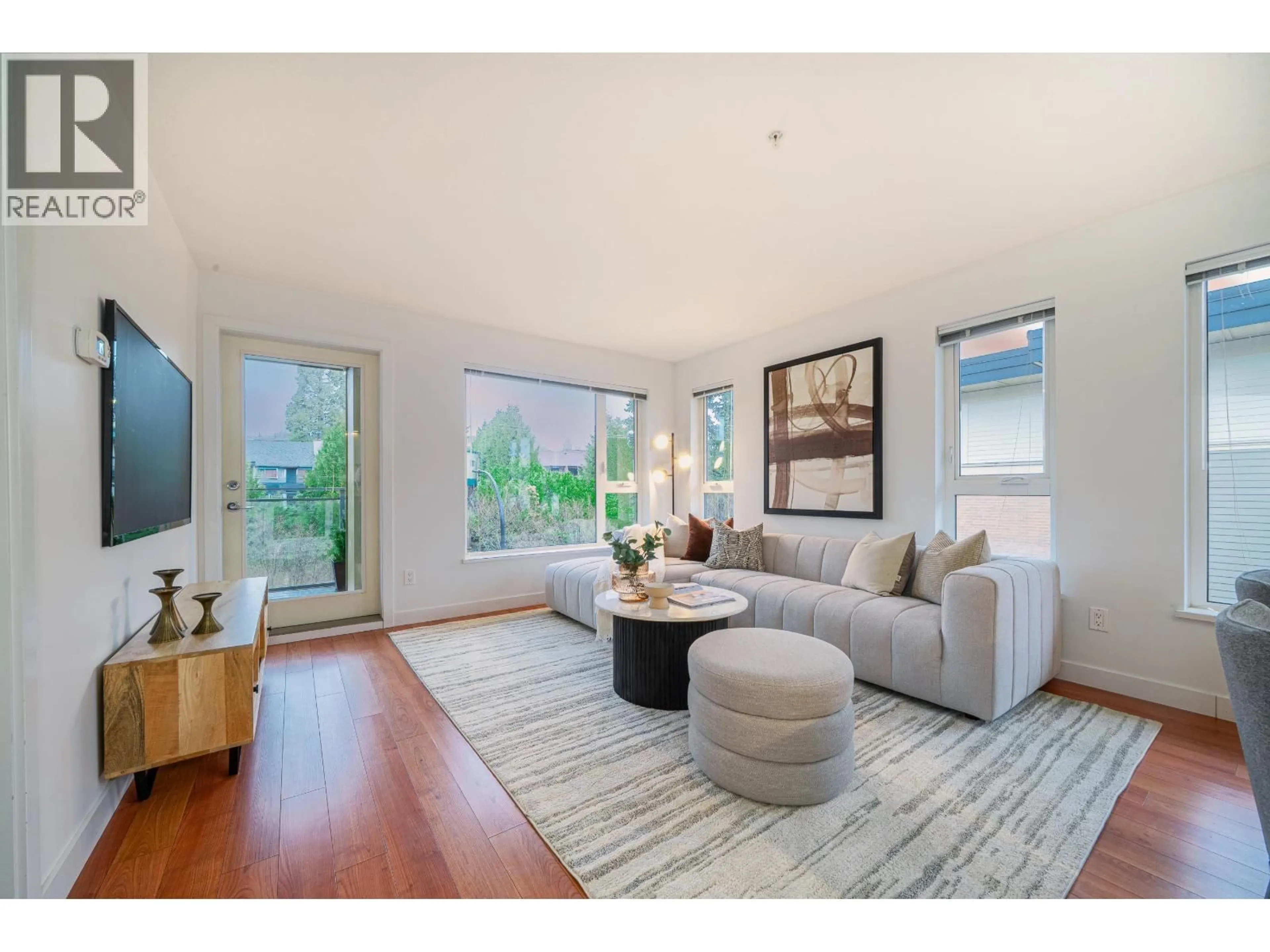 Living room with furniture, wood/laminate floor for 416 - 221 3RD STREET, North Vancouver British Columbia V7L0C1
