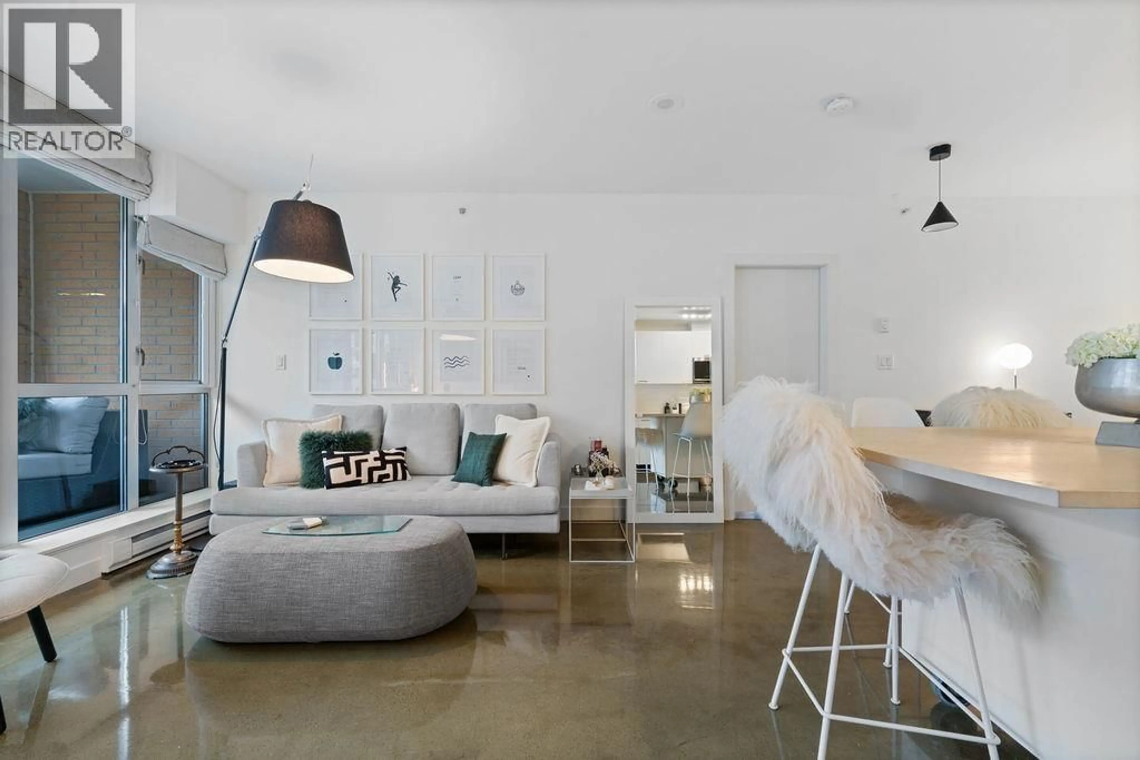 Living room with furniture, cement floor for 213 - 221 UNION STREET, Vancouver British Columbia V6A0B4