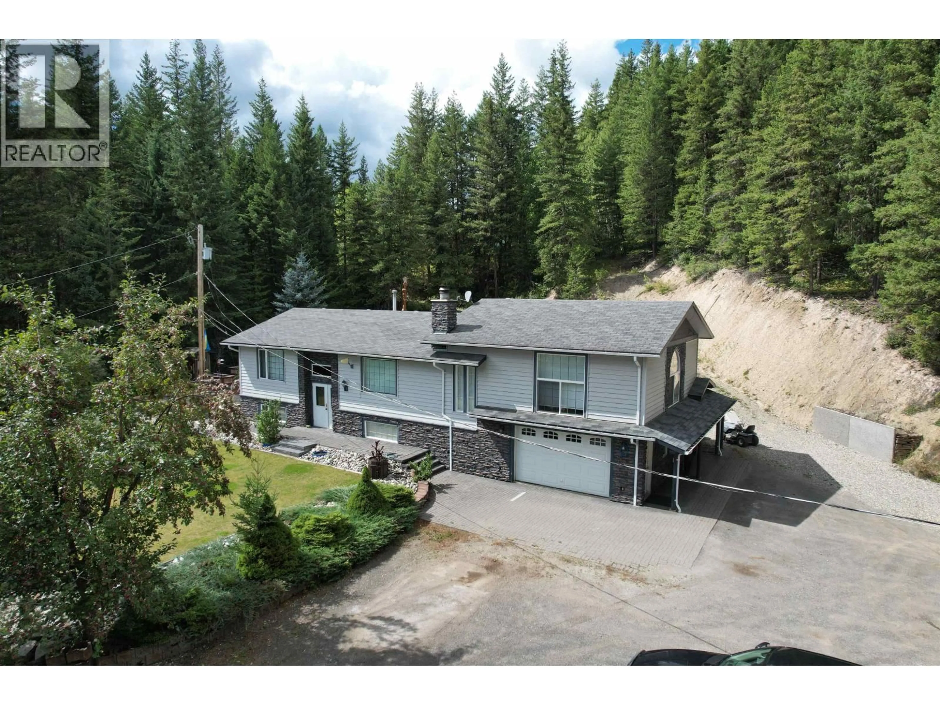 A pic from outside/outdoor area/front of a property/back of a property/a pic from drone, mountain view for 4487 DICK ROAD, Quesnel British Columbia V2J6W9