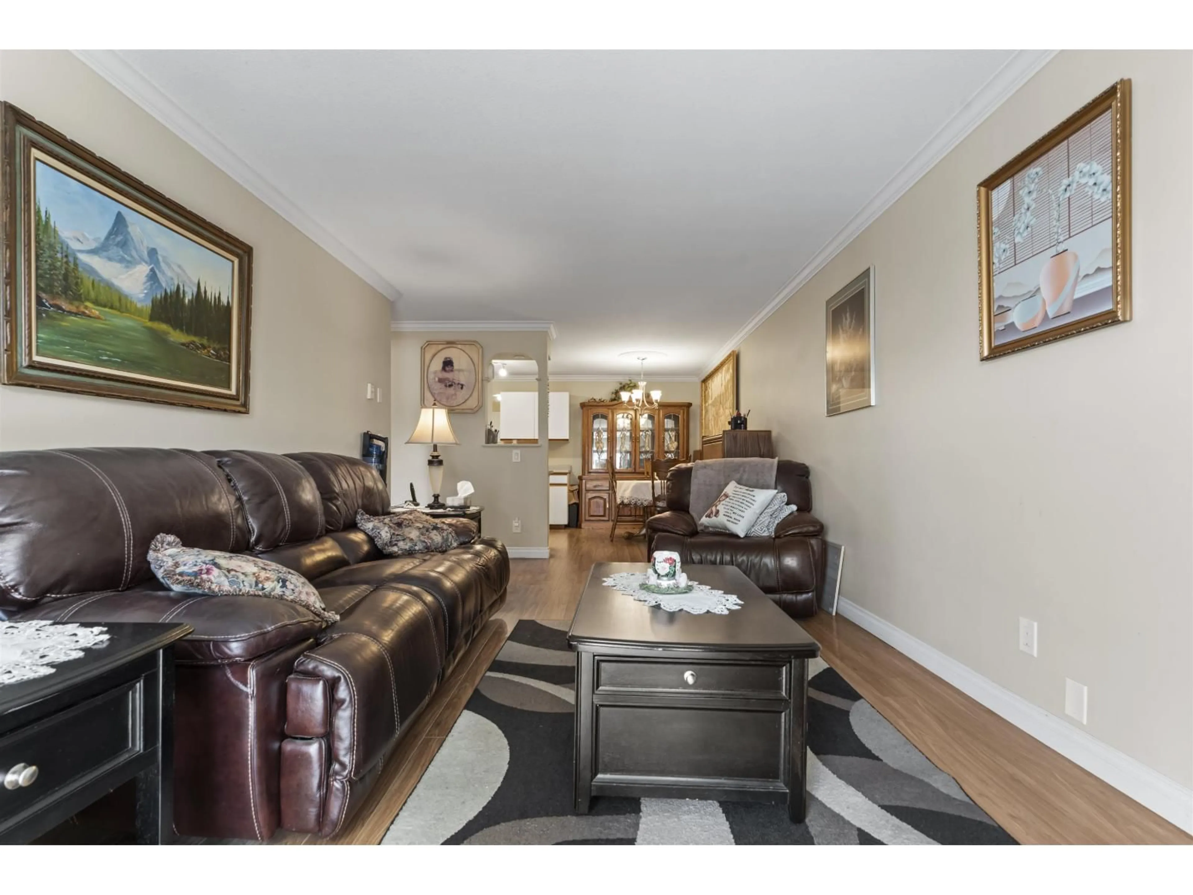 Living room with furniture, wood/laminate floor for 105 - 8934 MARY STREET, Chilliwack British Columbia V2P4J3