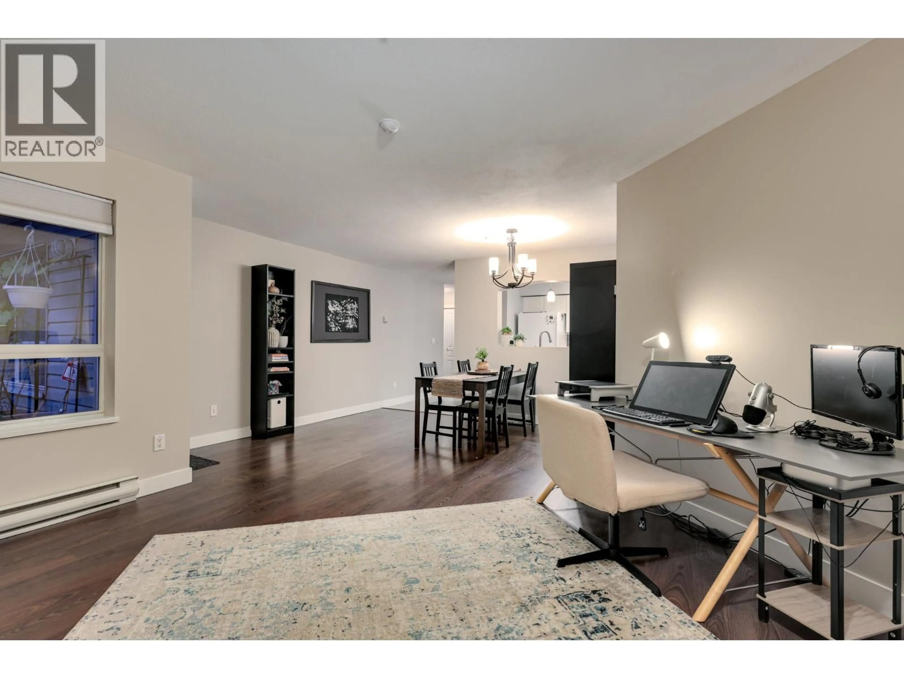 Living room with furniture, wood/laminate floor for 106 - 2439 WILSON AVENUE, Port Coquitlam British Columbia V3C6H6