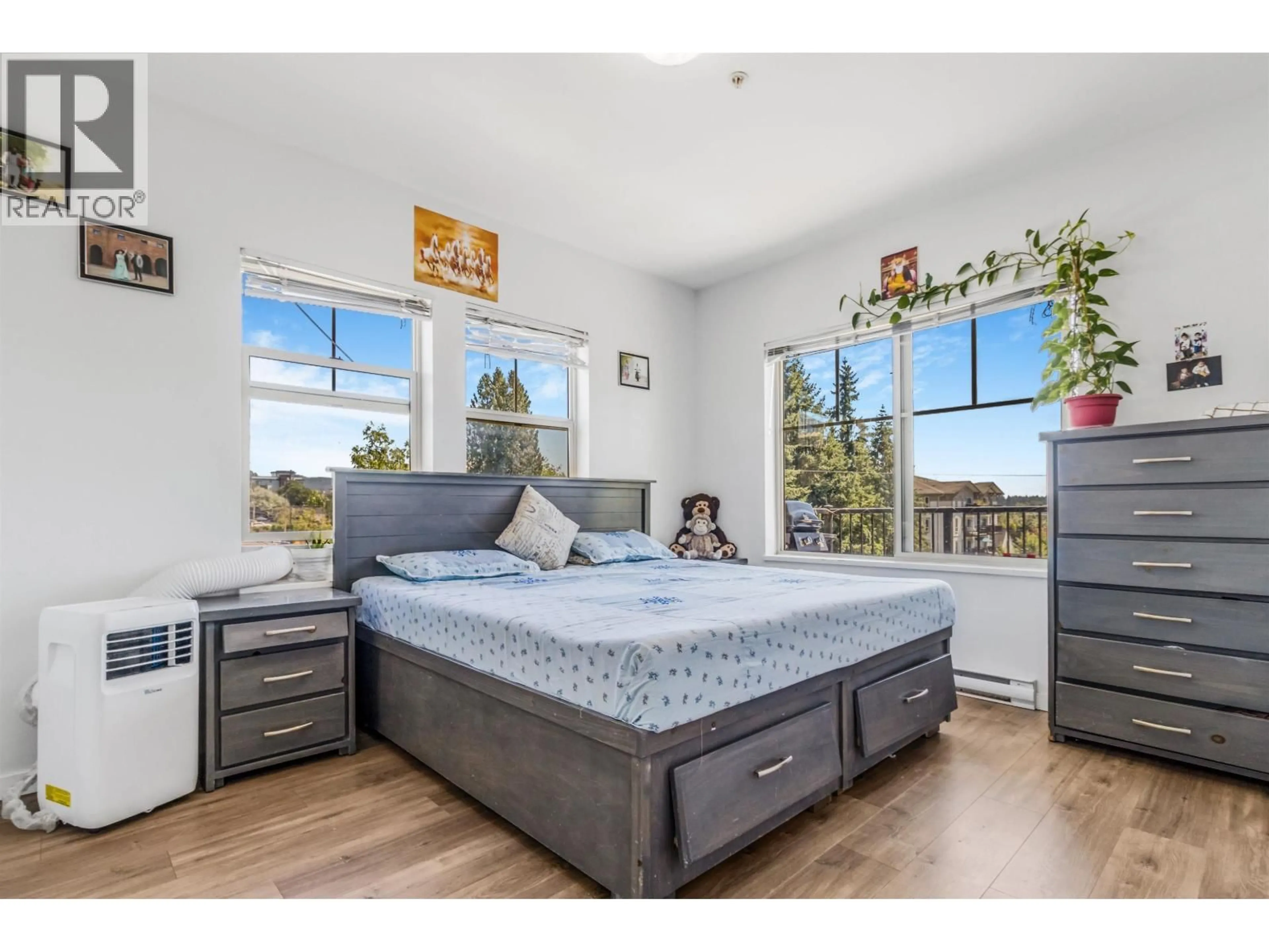 Bedroom with bed, wood/laminate floor for 306 - 22290 NORTH AVENUE, Maple Ridge British Columbia V2X8Z8