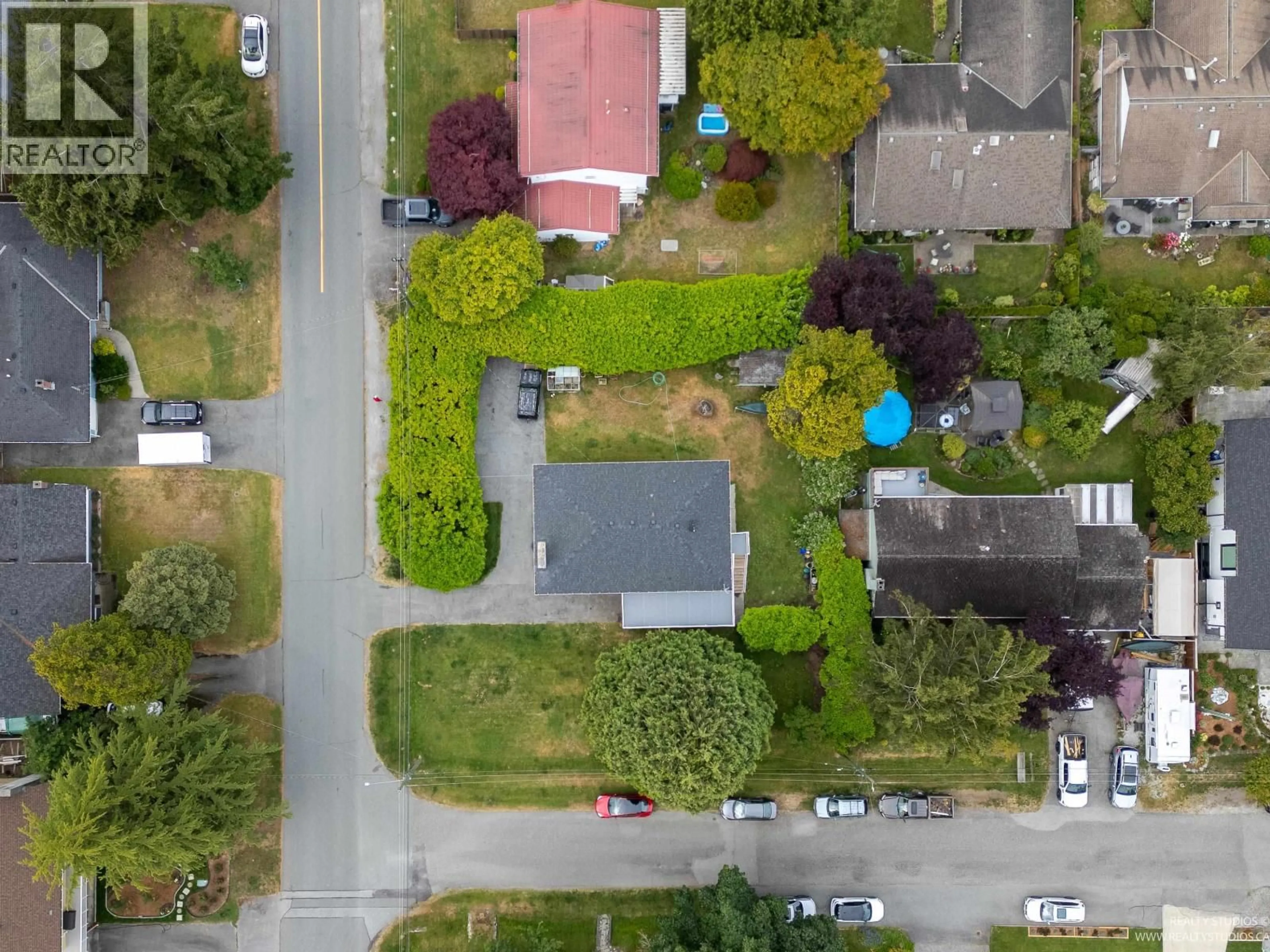 A pic from outside/outdoor area/front of a property/back of a property/a pic from drone, street for 4865 11A AVENUE, Delta British Columbia V4M1Z5
