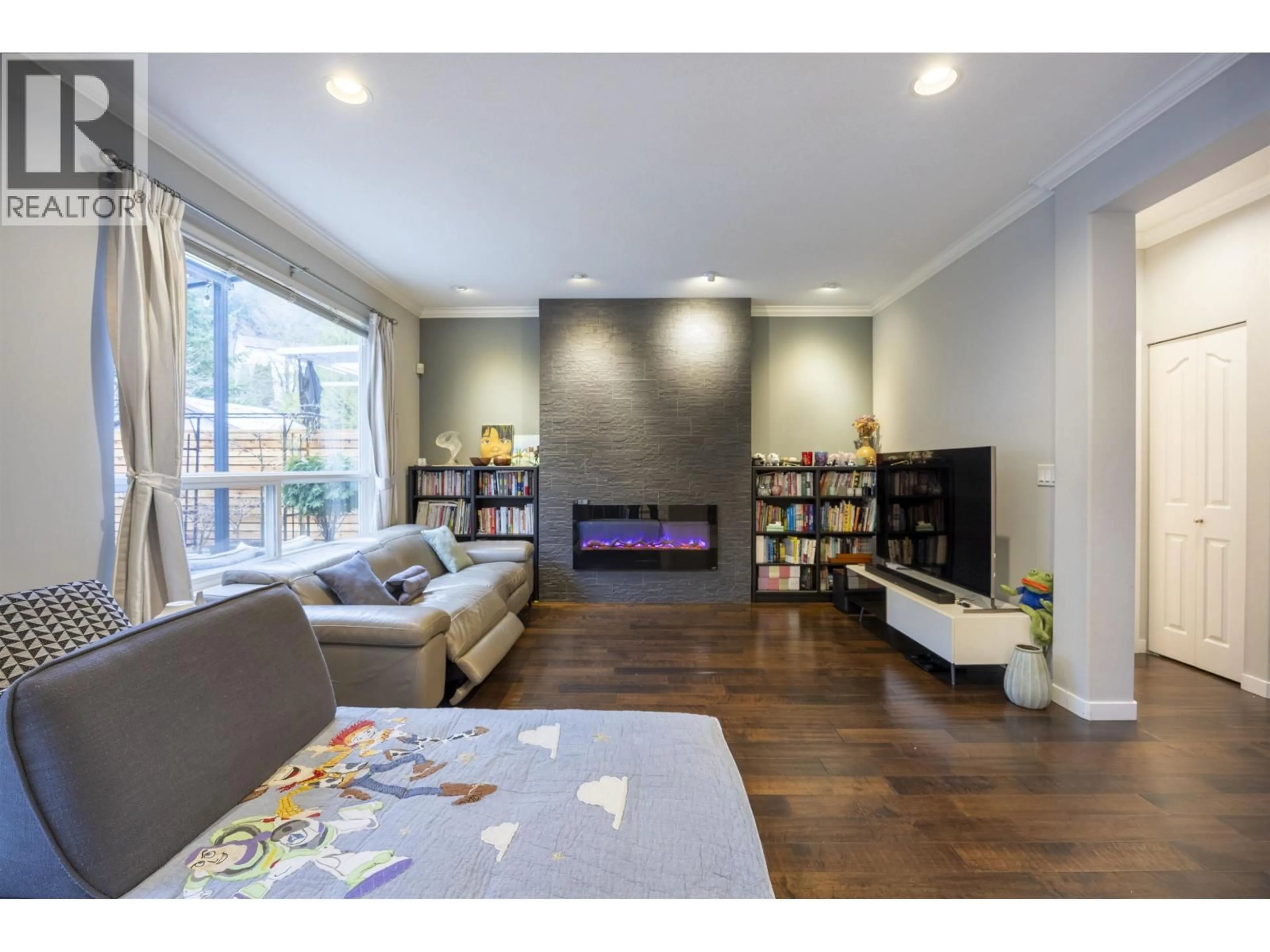 Living room with furniture, wood/laminate floor for 2503 QUARTZ PLACE, Coquitlam British Columbia V3E3K9