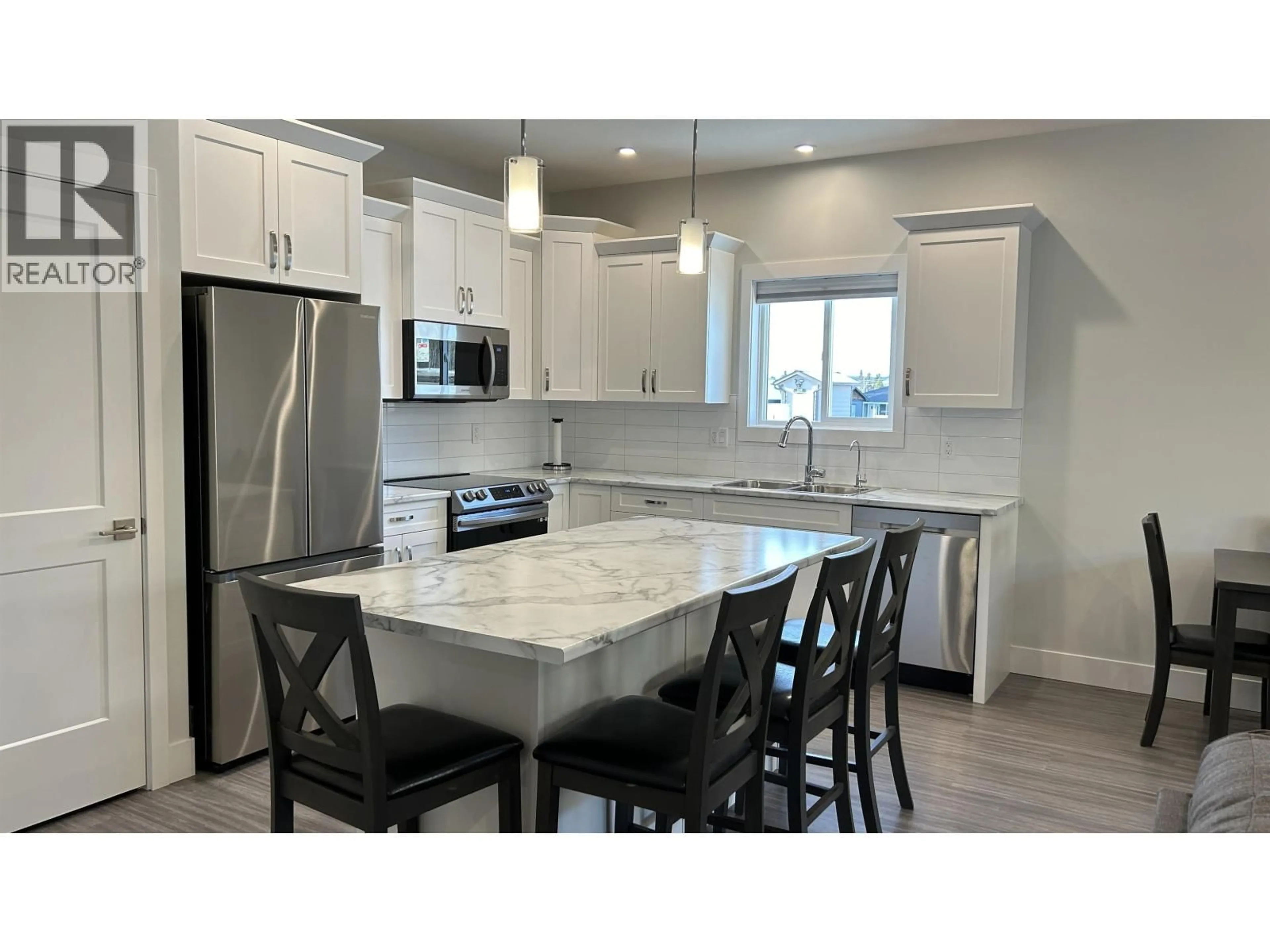 Open concept kitchen, ceramic/tile floor for 15 - 105 FOREST RIDGE ROAD, 100 Mile House British Columbia V0K2E0
