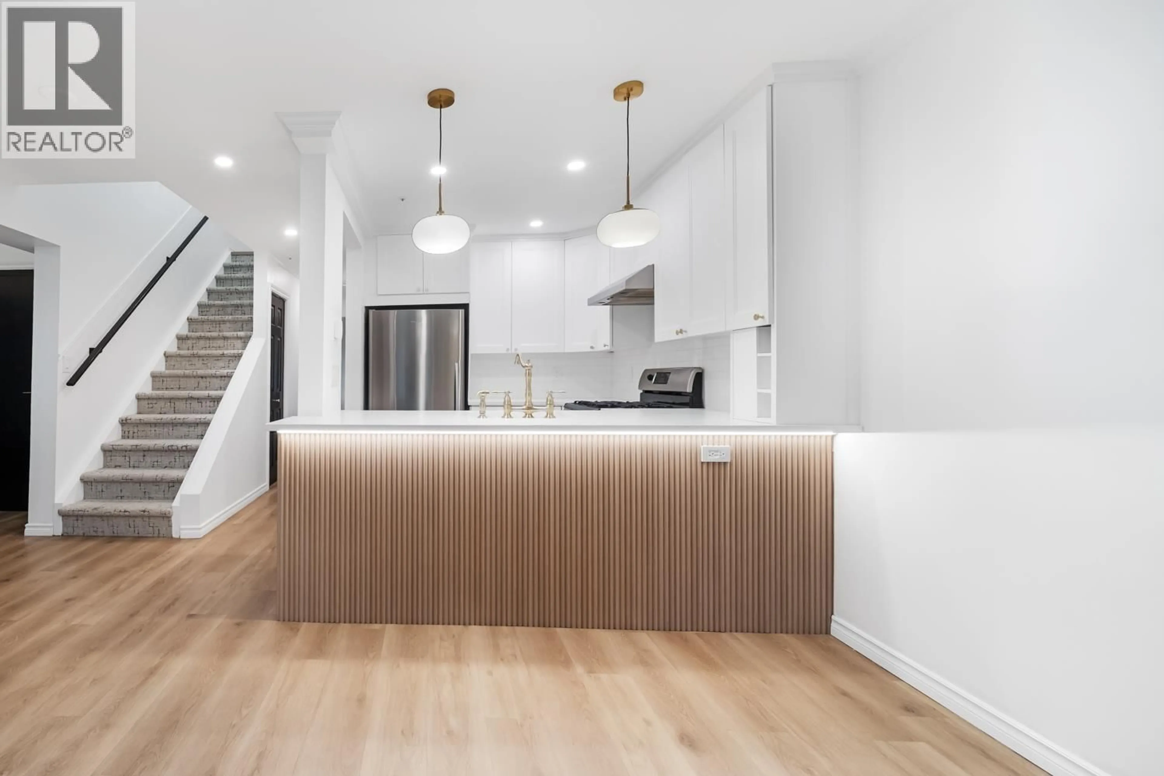 Open concept kitchen, wood/laminate floor for 1407 PENDRELL STREET, Vancouver British Columbia V6G1S3