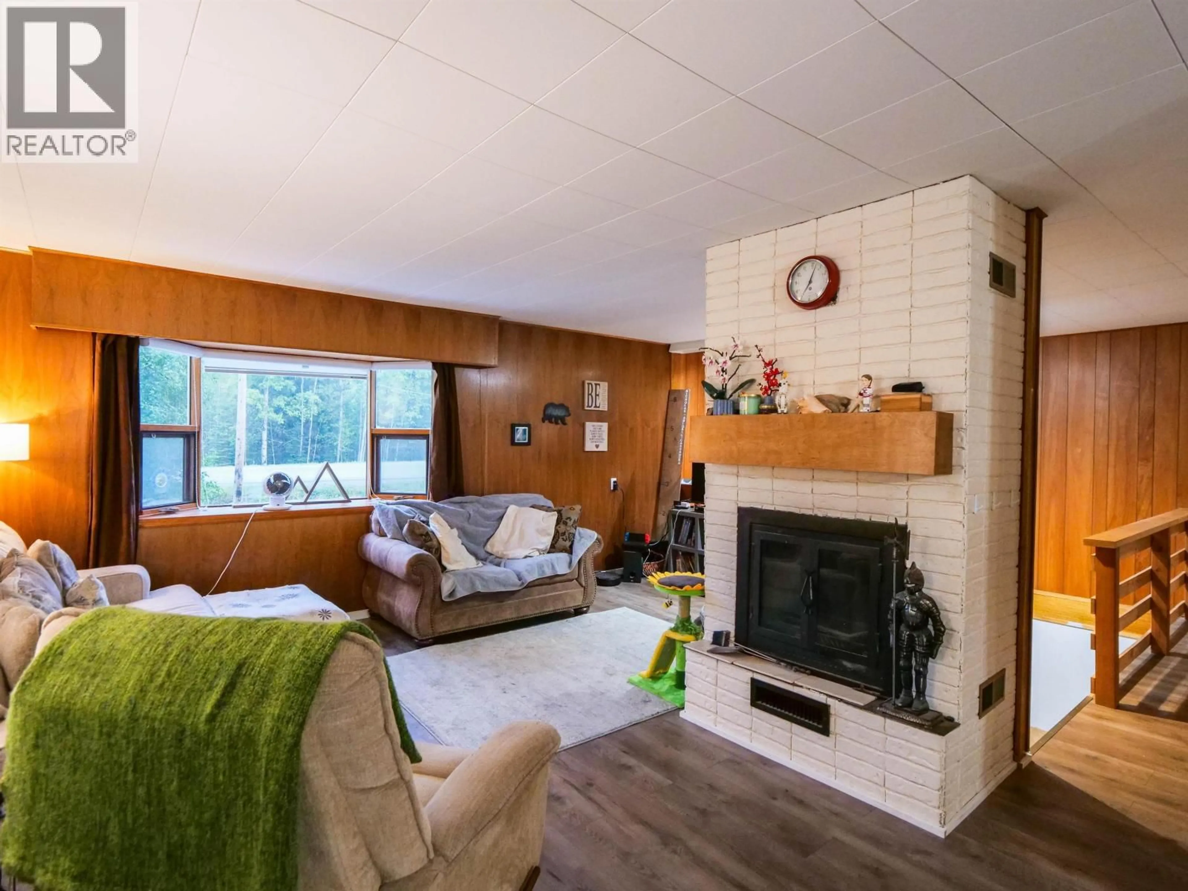 Living room with furniture, wood/laminate floor for 2988 NAZKO ROAD, Quesnel British Columbia V2J7E9