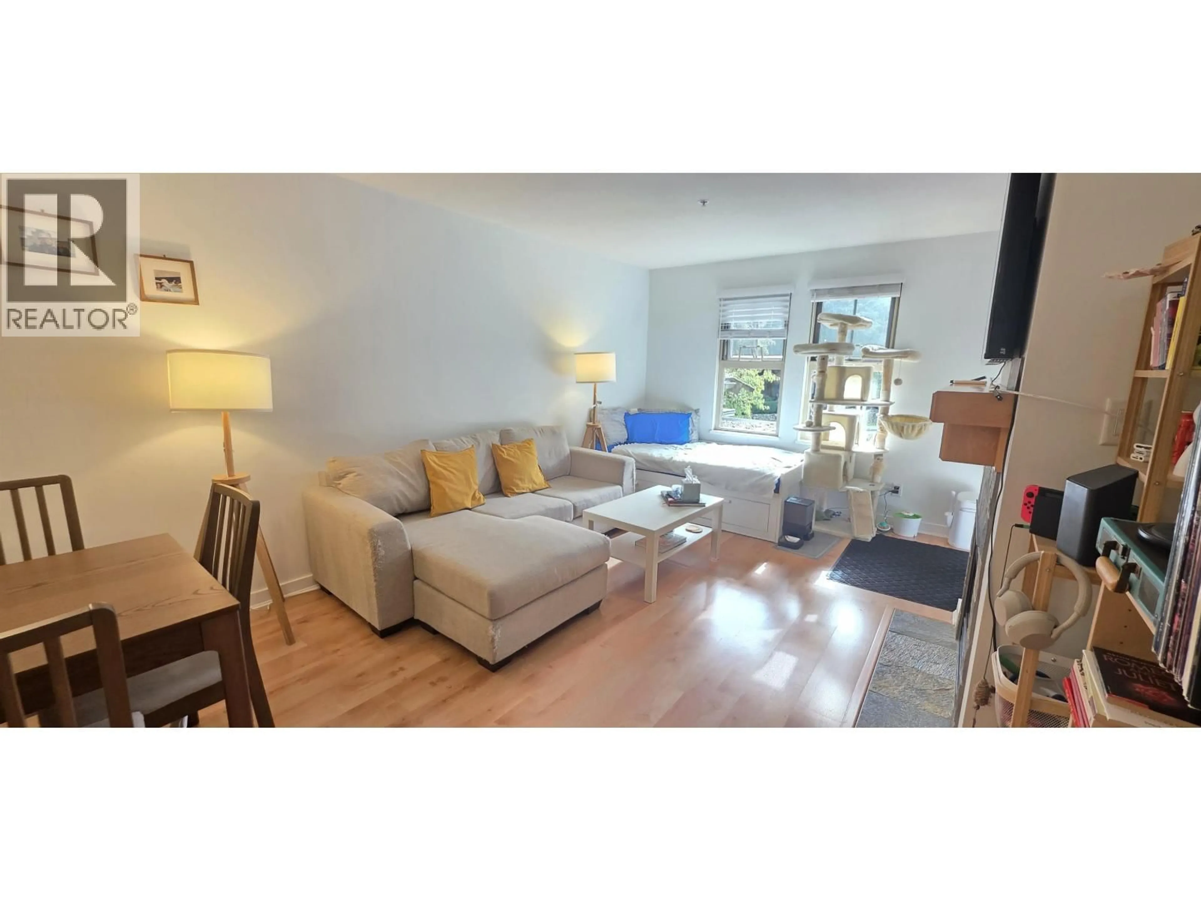 Living room with furniture, wood/laminate floor for 201 - 15 SMOKEY SMITH PLACE, New Westminster British Columbia V3L5V7