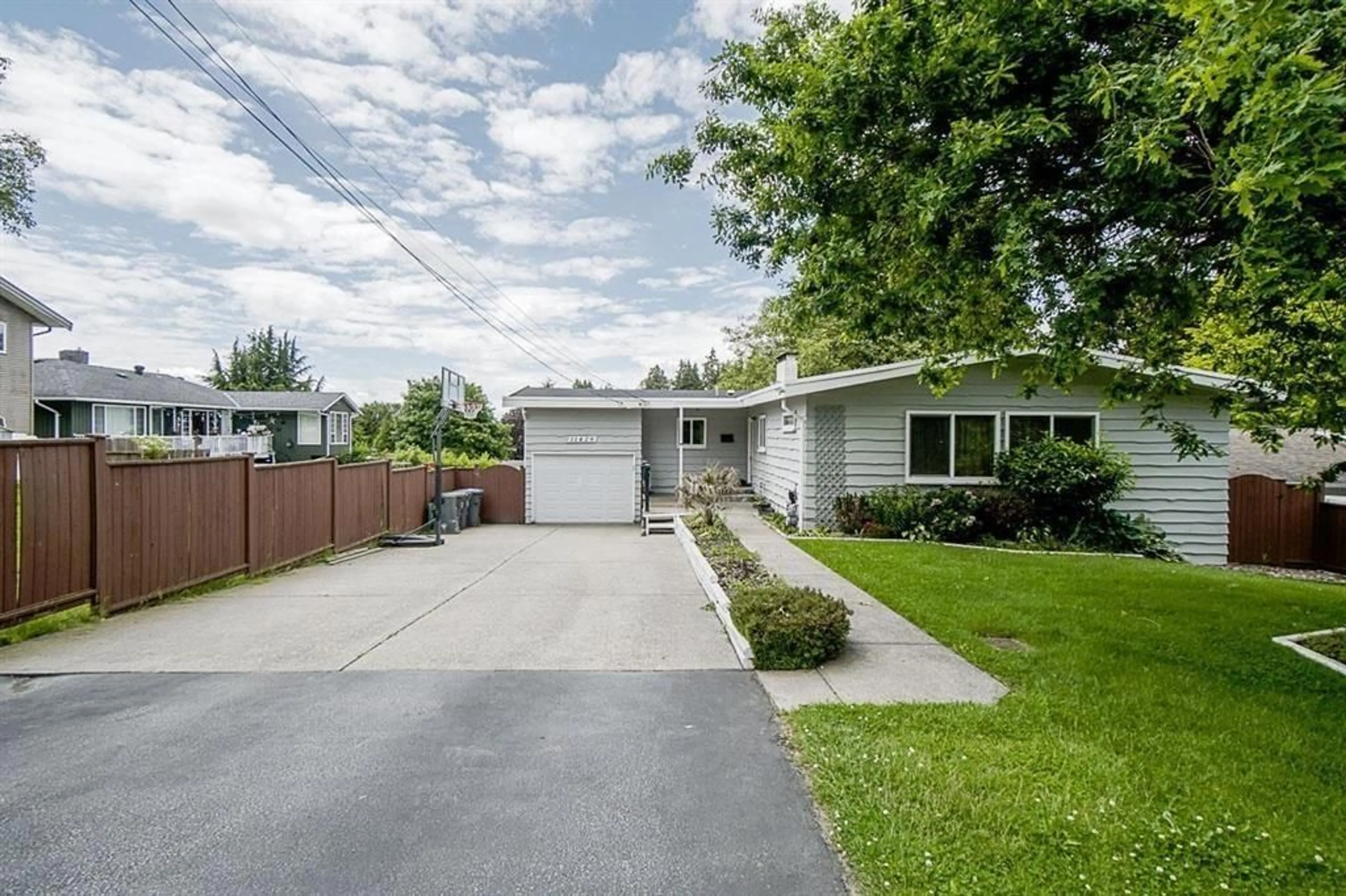 Home with vinyl exterior material, street for 11429 139A STREET, Surrey British Columbia V3R3E9