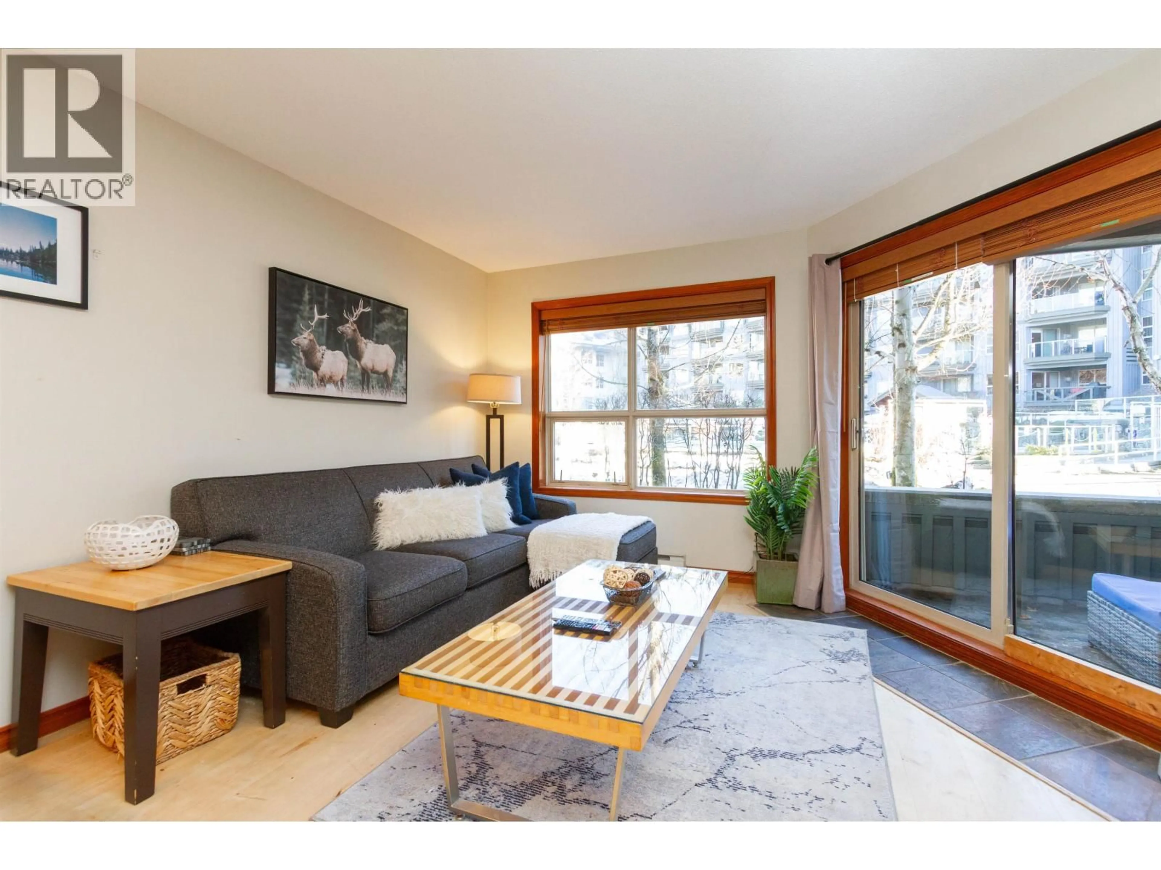 Living room with furniture, wood/laminate floor for 107 - 4800 SPEARHEAD DRIVE, Whistler British Columbia V8E1G1