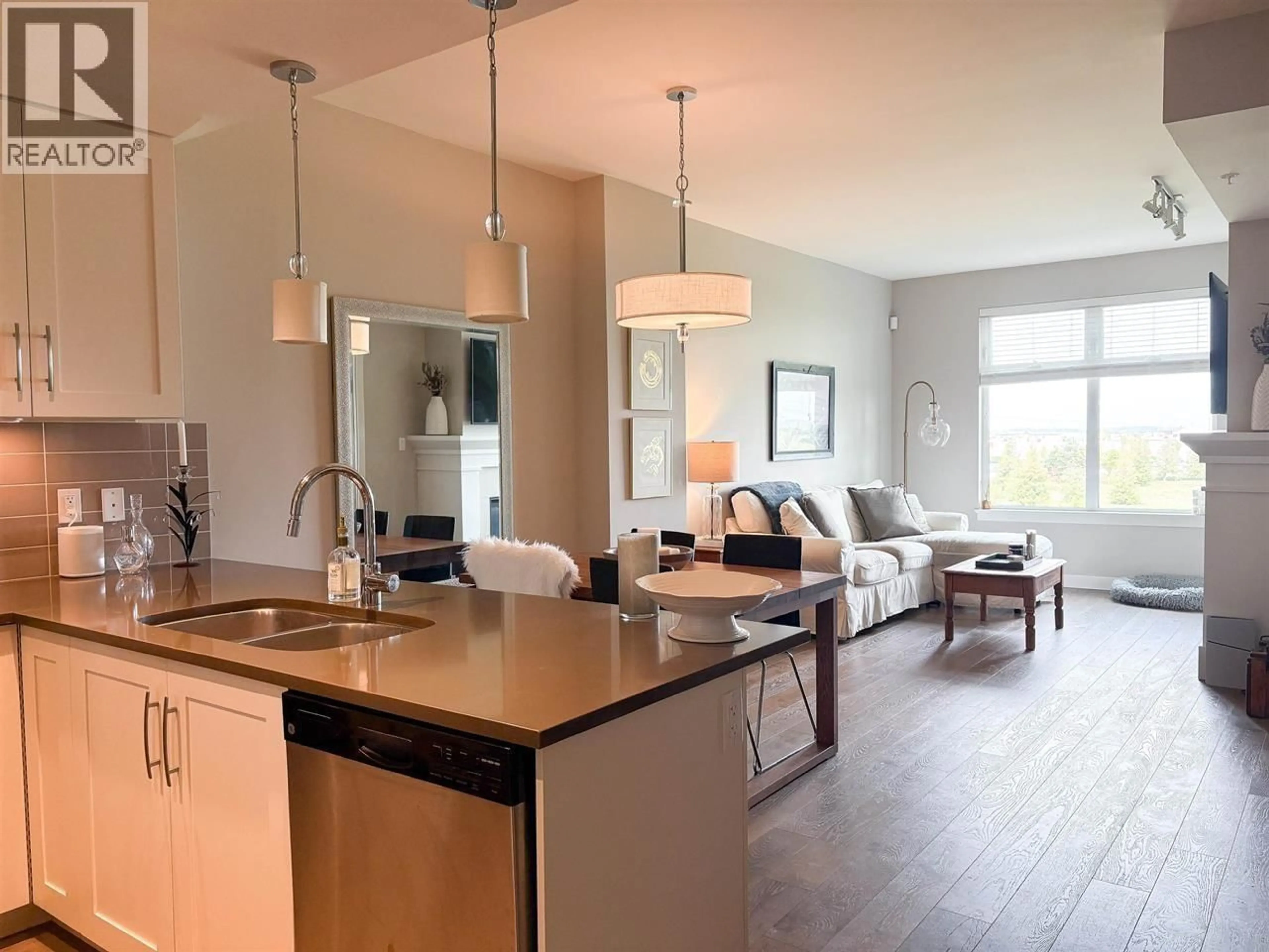 Open concept kitchen, wood/laminate floor for 410 - 5011 SPRINGS BOULEVARD, Delta British Columbia V4M0B6