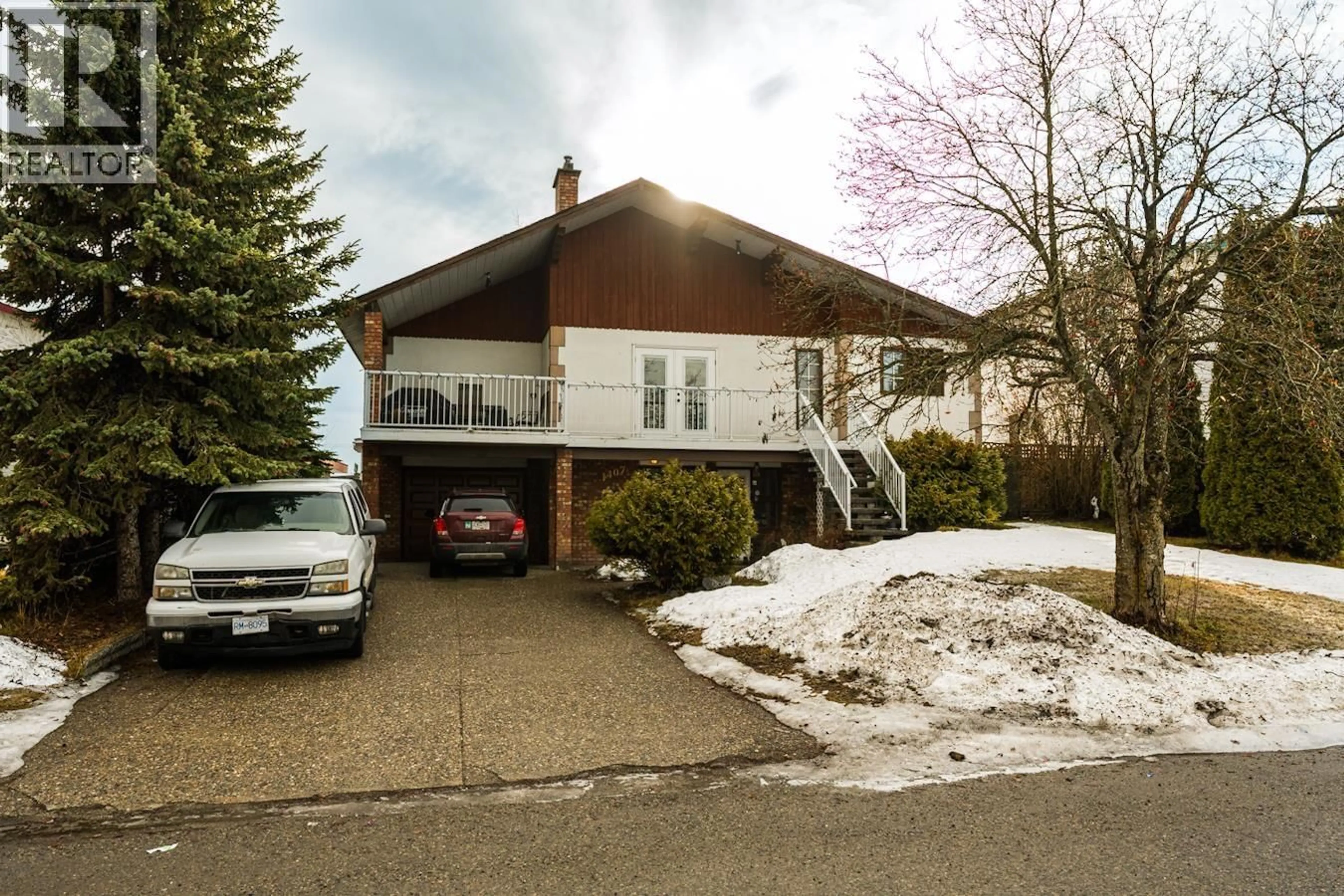 Home with vinyl exterior material, street for 1407 FRASER CRESCENT, Prince George British Columbia V2M3Y1