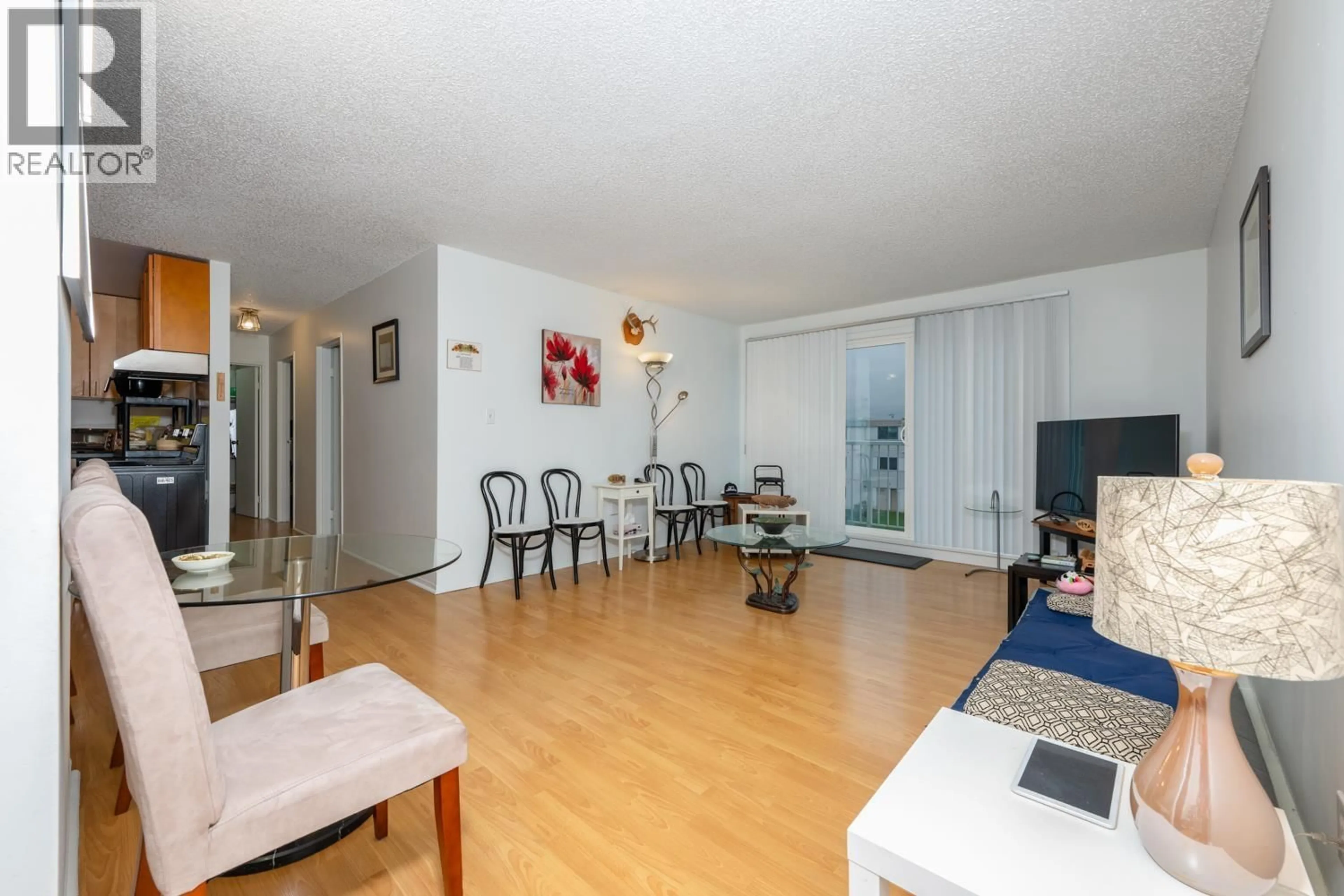 Living room with furniture, wood/laminate floor for 310 - 7240 LINDSAY ROAD, Richmond British Columbia V7C3M6