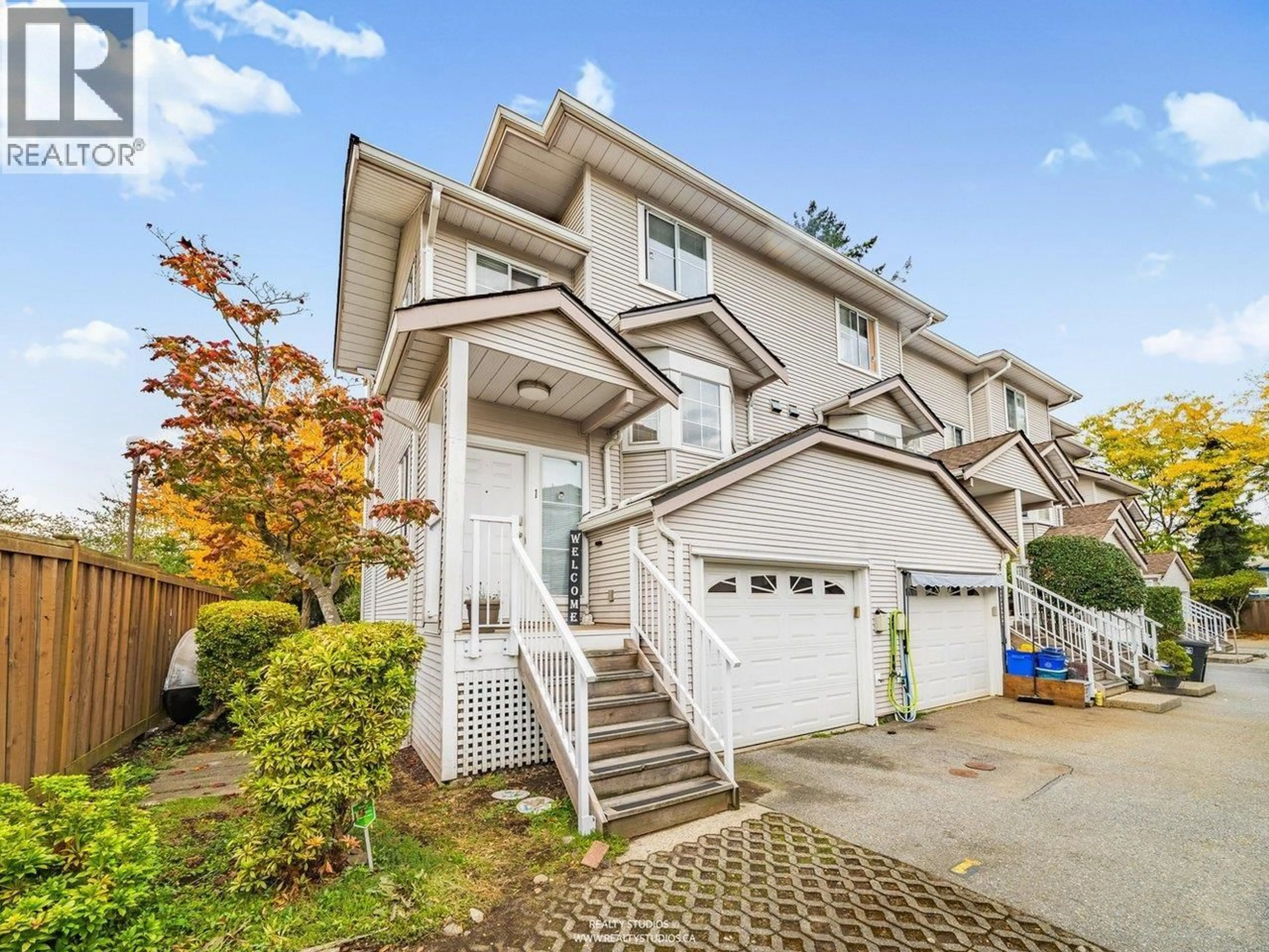 Home with vinyl exterior material, street for 1 - 12188 HARRIS ROAD, Pitt Meadows British Columbia V3Y2N3