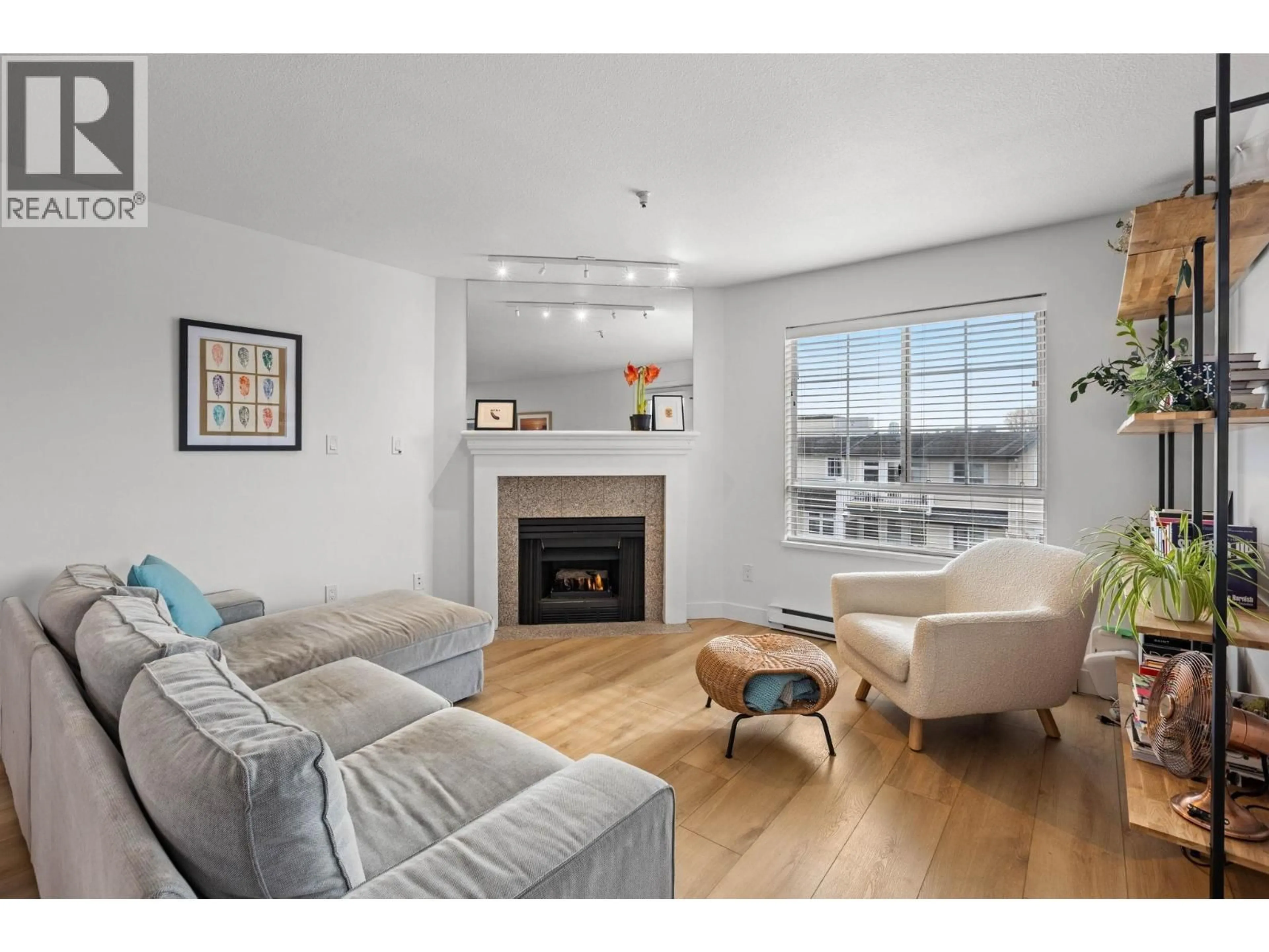 Living room with furniture, wood/laminate floor for 407 - 1950 11TH AVENUE, Vancouver British Columbia V5N1Z2