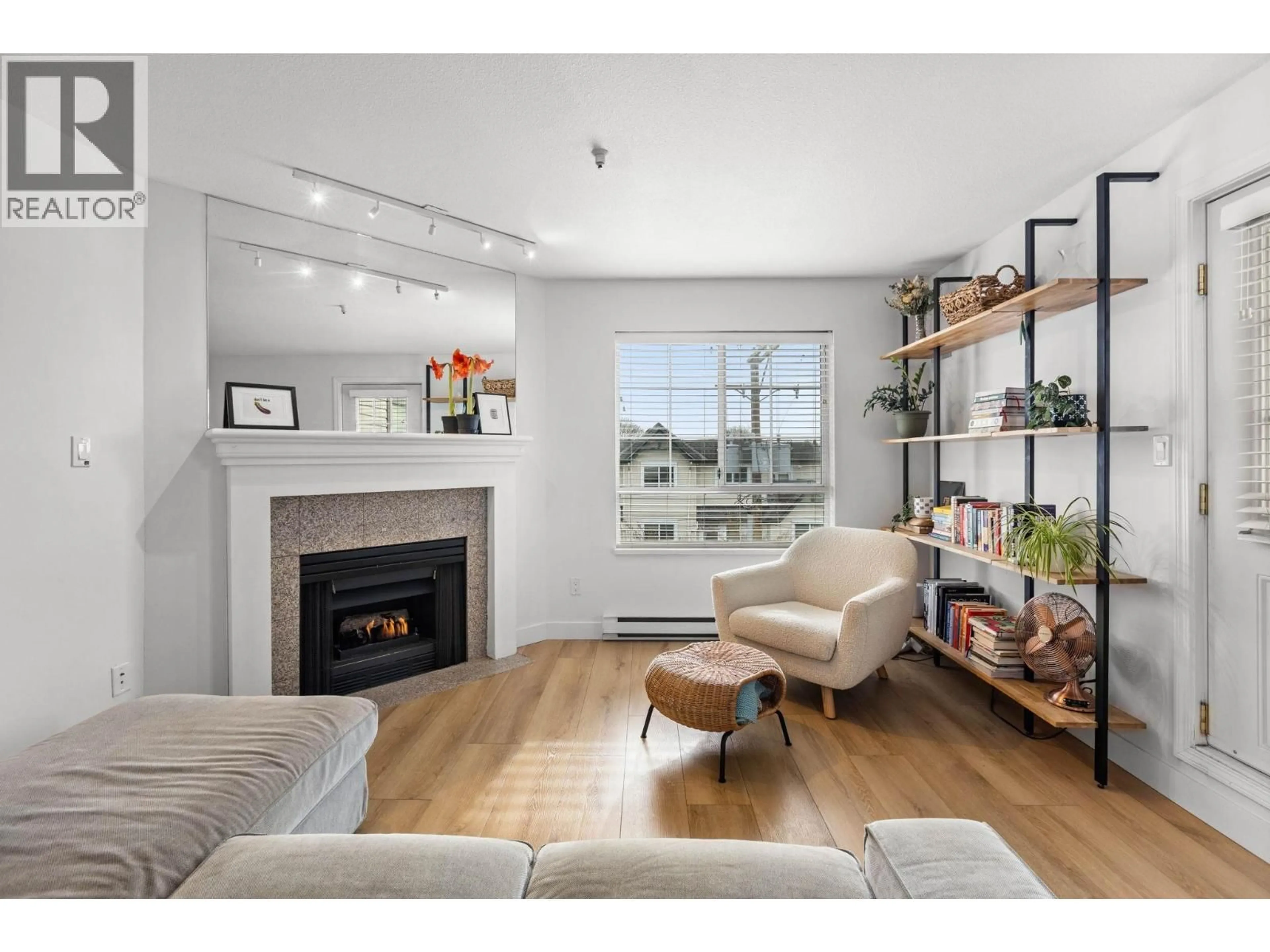 Living room with furniture, wood/laminate floor for 407 - 1950 11TH AVENUE, Vancouver British Columbia V5N1Z2