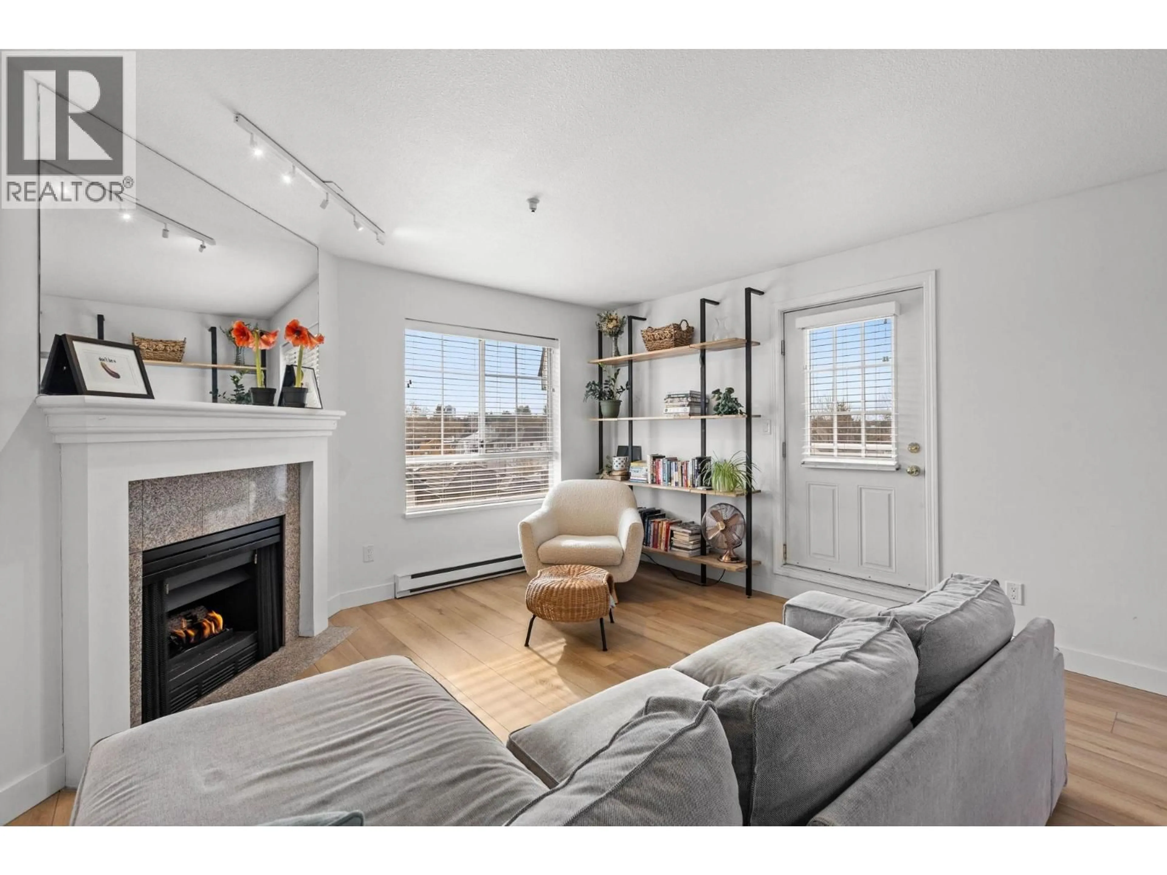 Living room with furniture, wood/laminate floor for 407 - 1950 11TH AVENUE, Vancouver British Columbia V5N1Z2