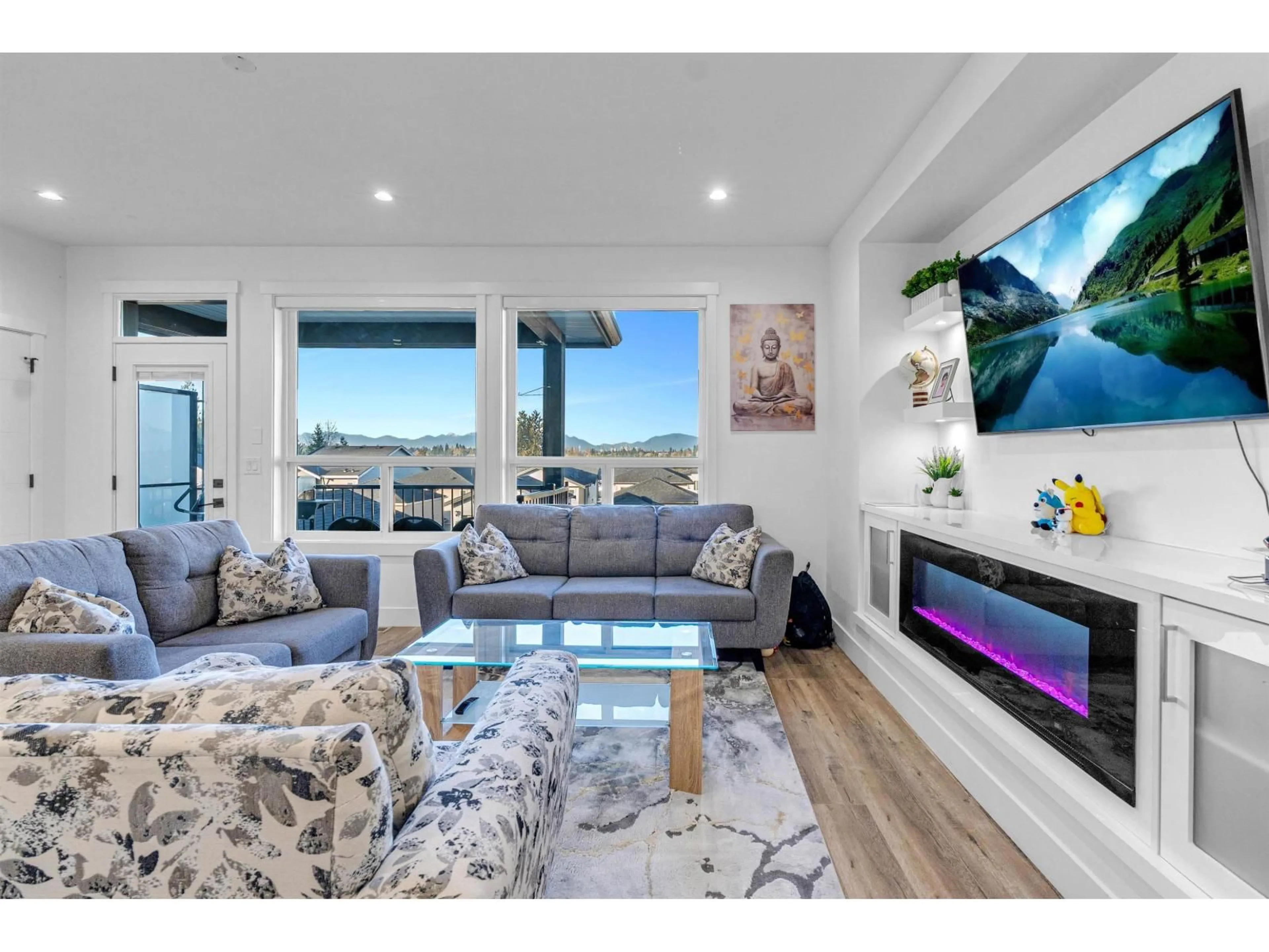 Living room with furniture, wood/laminate floor for 13963 60 AVENUE, Surrey British Columbia V3X2M9