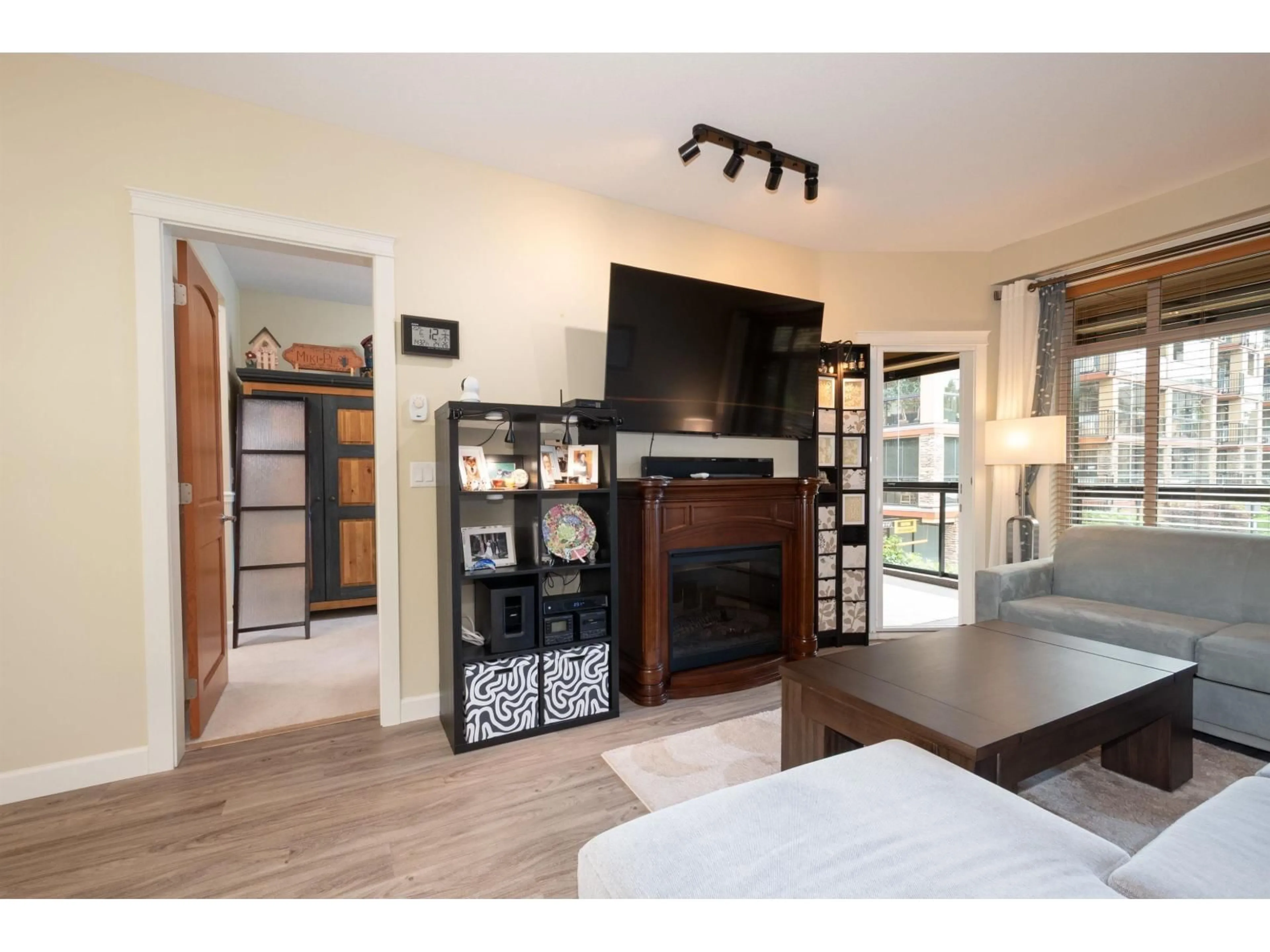 Living room with furniture, wood/laminate floor for 282 - 8288 207A STREET, Langley British Columbia V2Y0L2