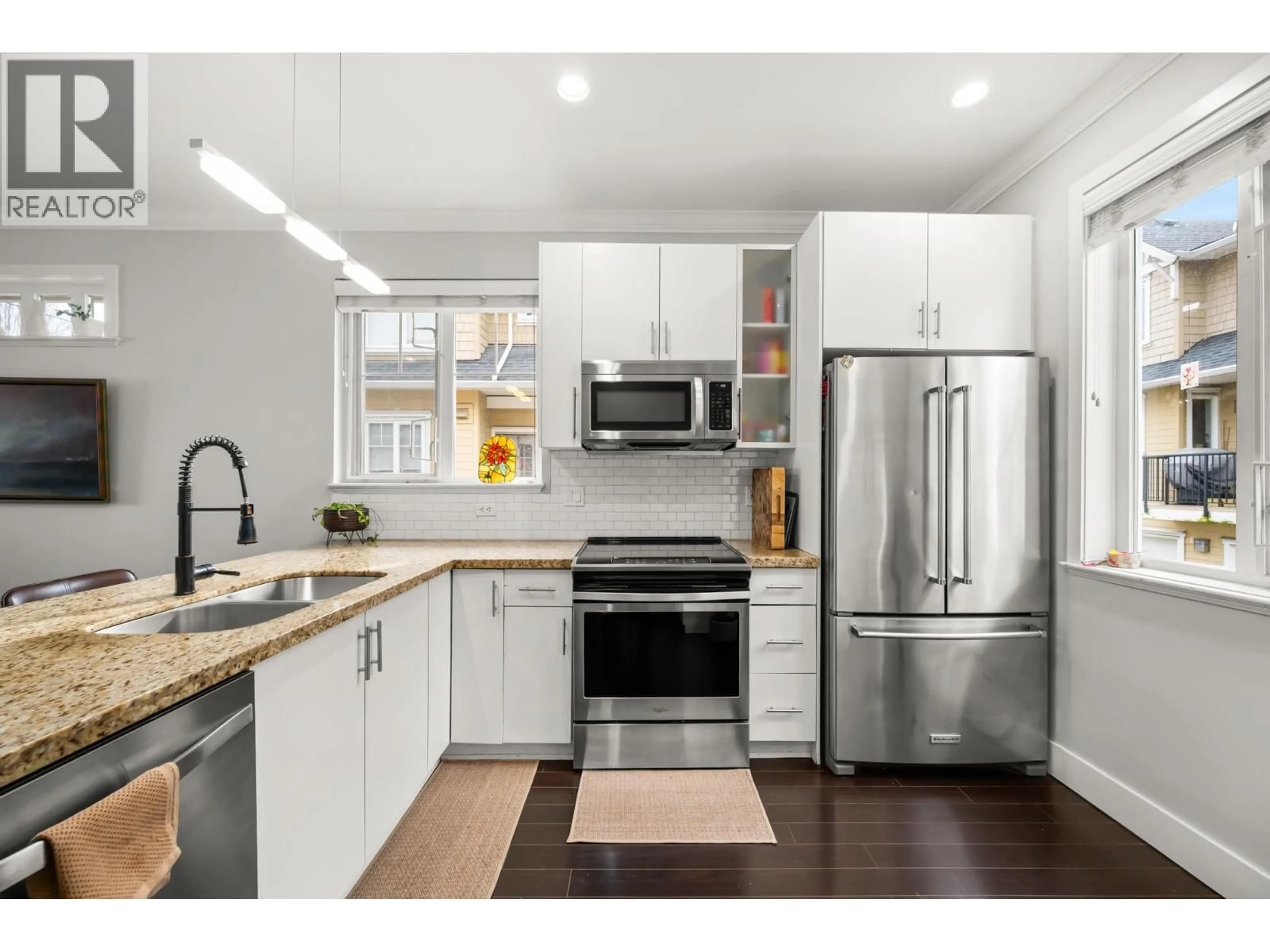 Open concept kitchen, wood/laminate floor for 1407 28TH AVENUE, Vancouver British Columbia V5N2X3