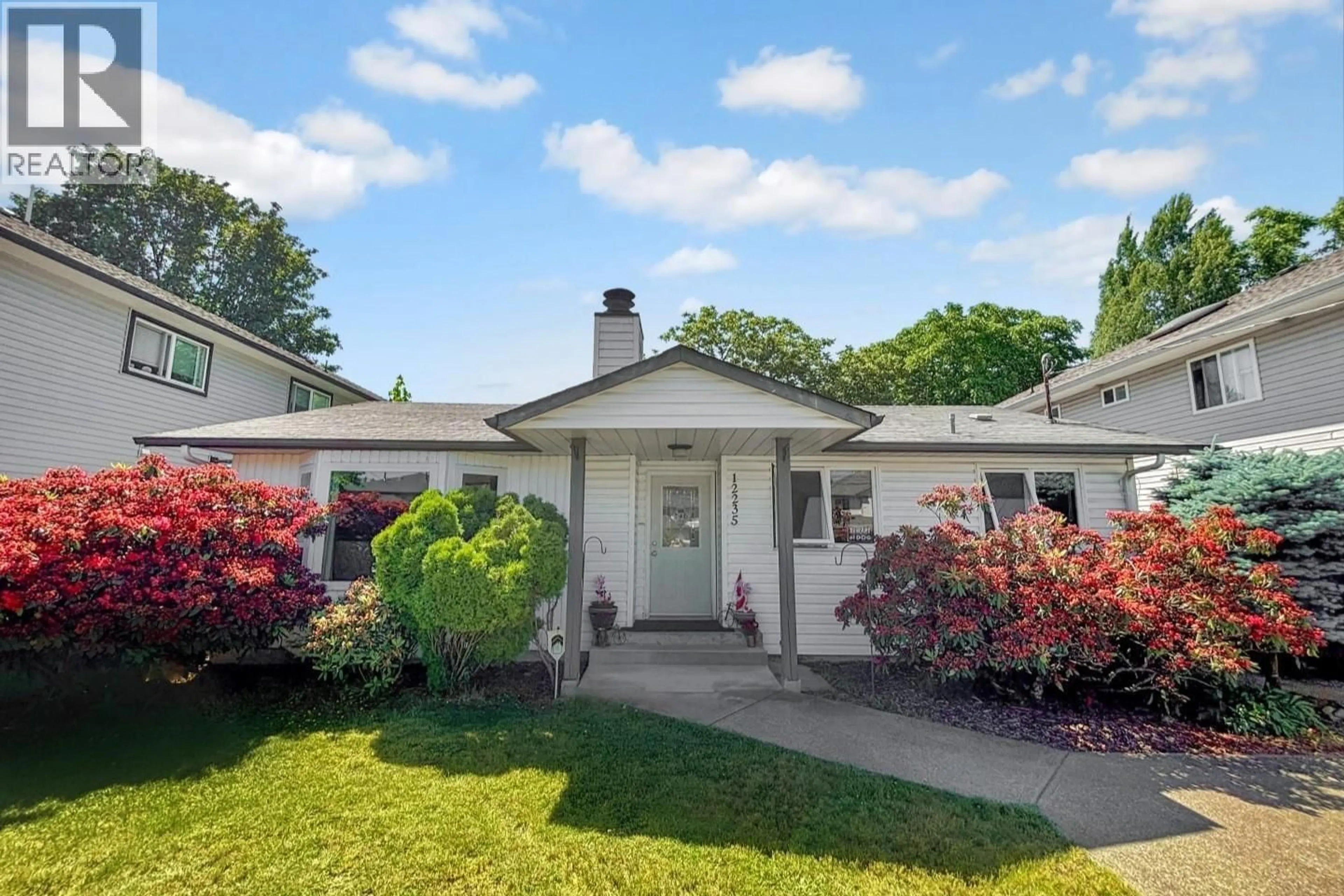 Home with vinyl exterior material, street for 12235 MCMYN AVENUE, Pitt Meadows British Columbia V3Y1C8