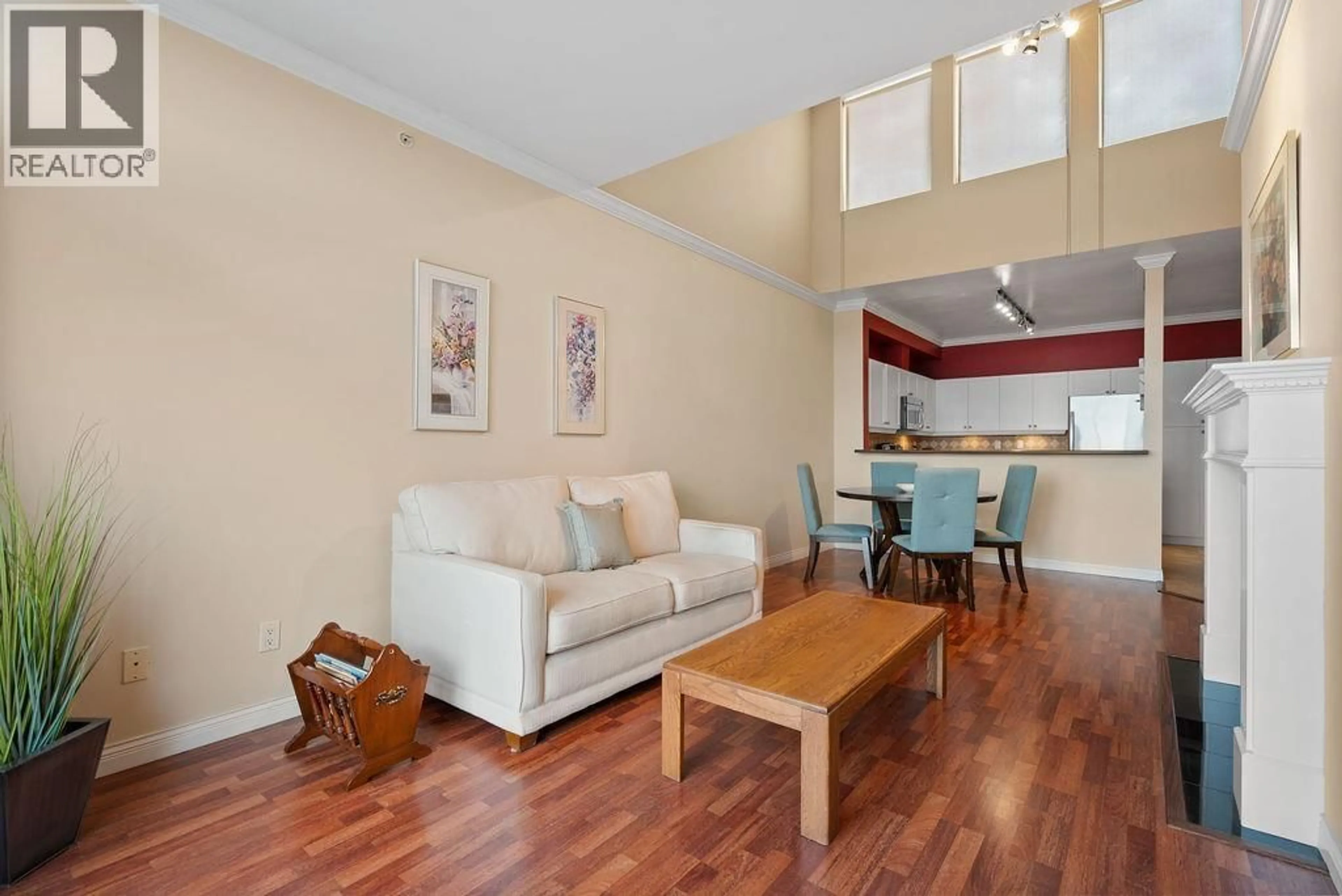 Living room with furniture, wood/laminate floor for 407 - 5800 ANDREWS ROAD, Richmond British Columbia V7E6M2