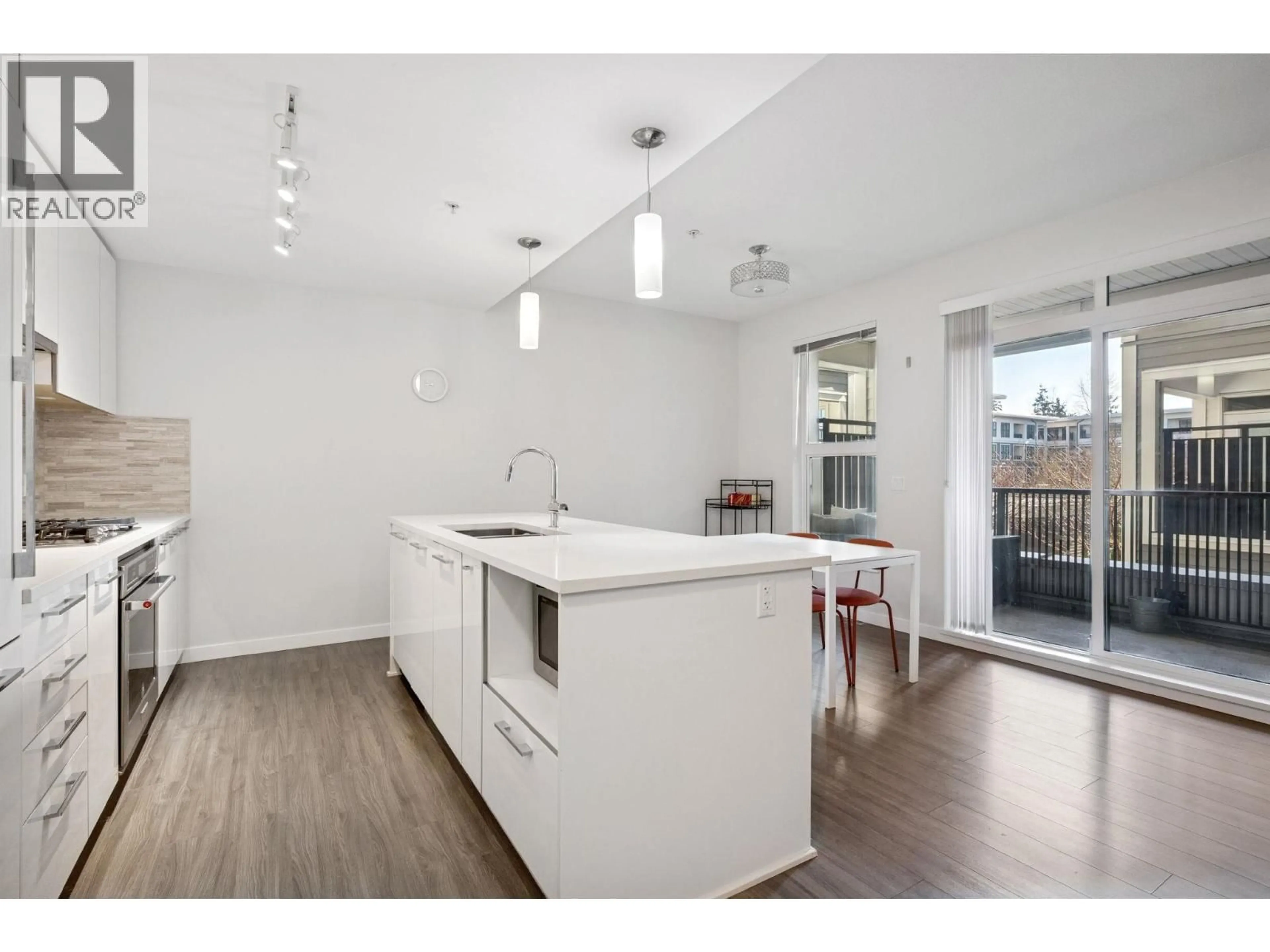 Open concept kitchen, wood/laminate floor for 222 - 9500 TOMICKI AVENUE, Richmond British Columbia V6X0R9