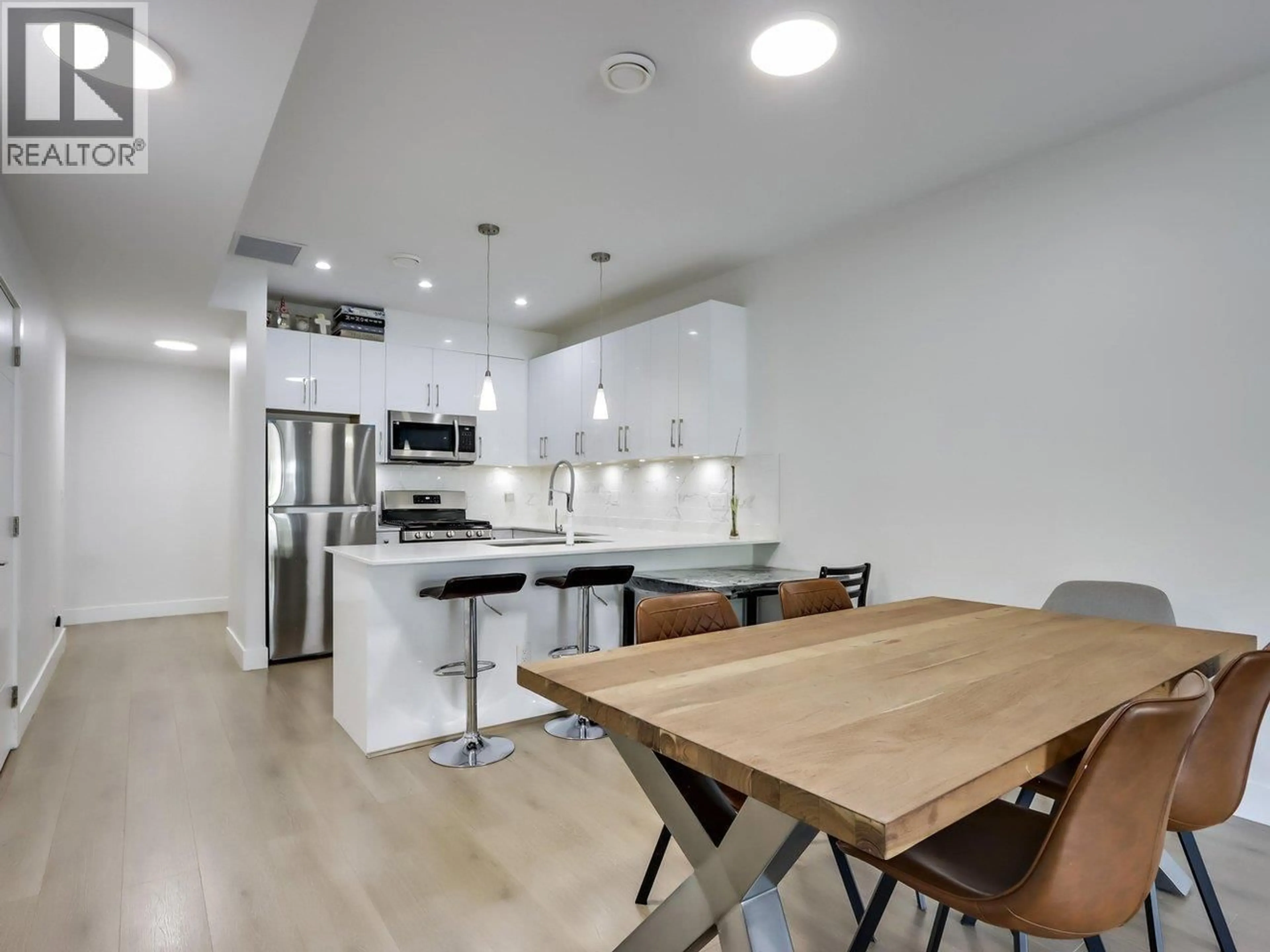 Open concept kitchen, unknown for 103 - 906 QUADLING AVENUE, Coquitlam British Columbia V3K2A5