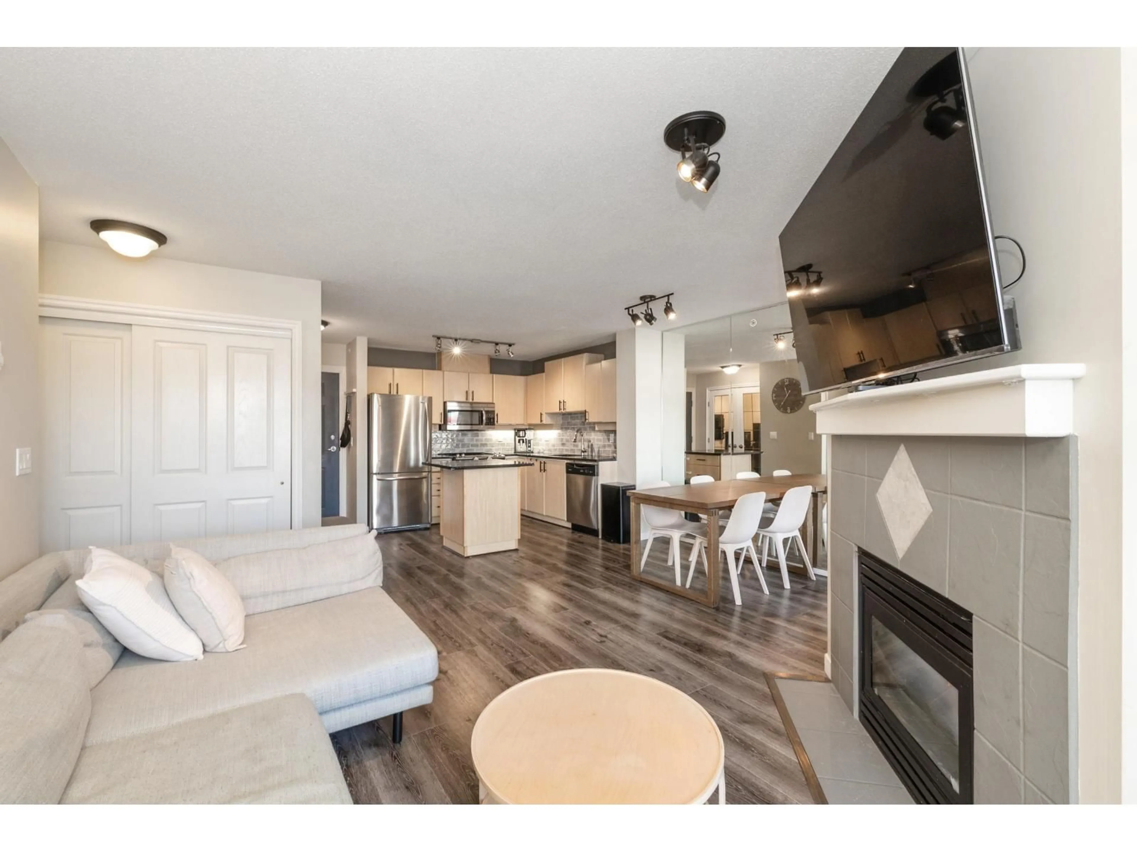 Open concept kitchen, wood/laminate floor for 304 - 6336 197 STREET, Langley British Columbia V2Y2T7