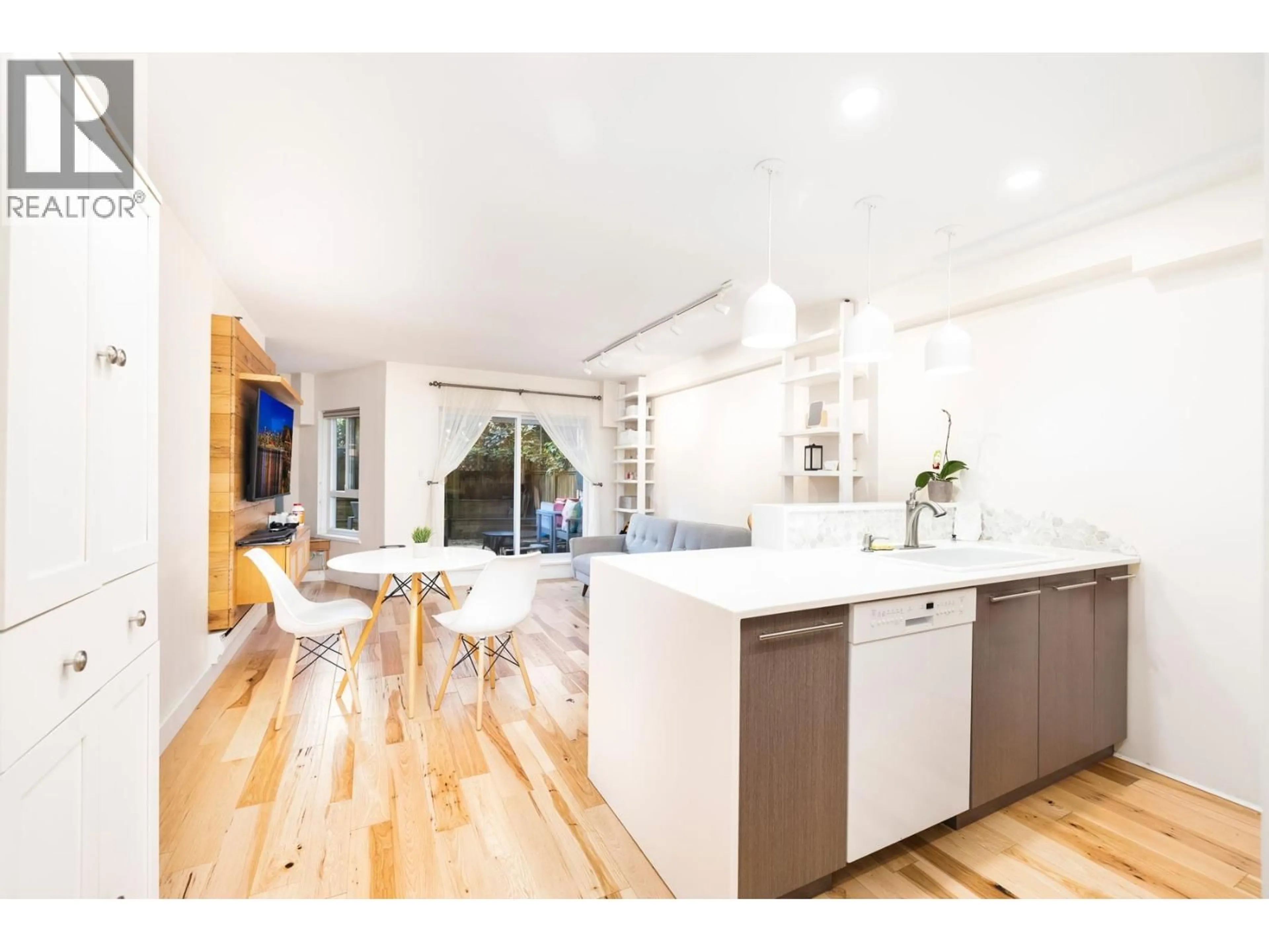 Open concept kitchen, wood/laminate floor for 112 - 825 7TH AVENUE, Vancouver British Columbia V5T1P4