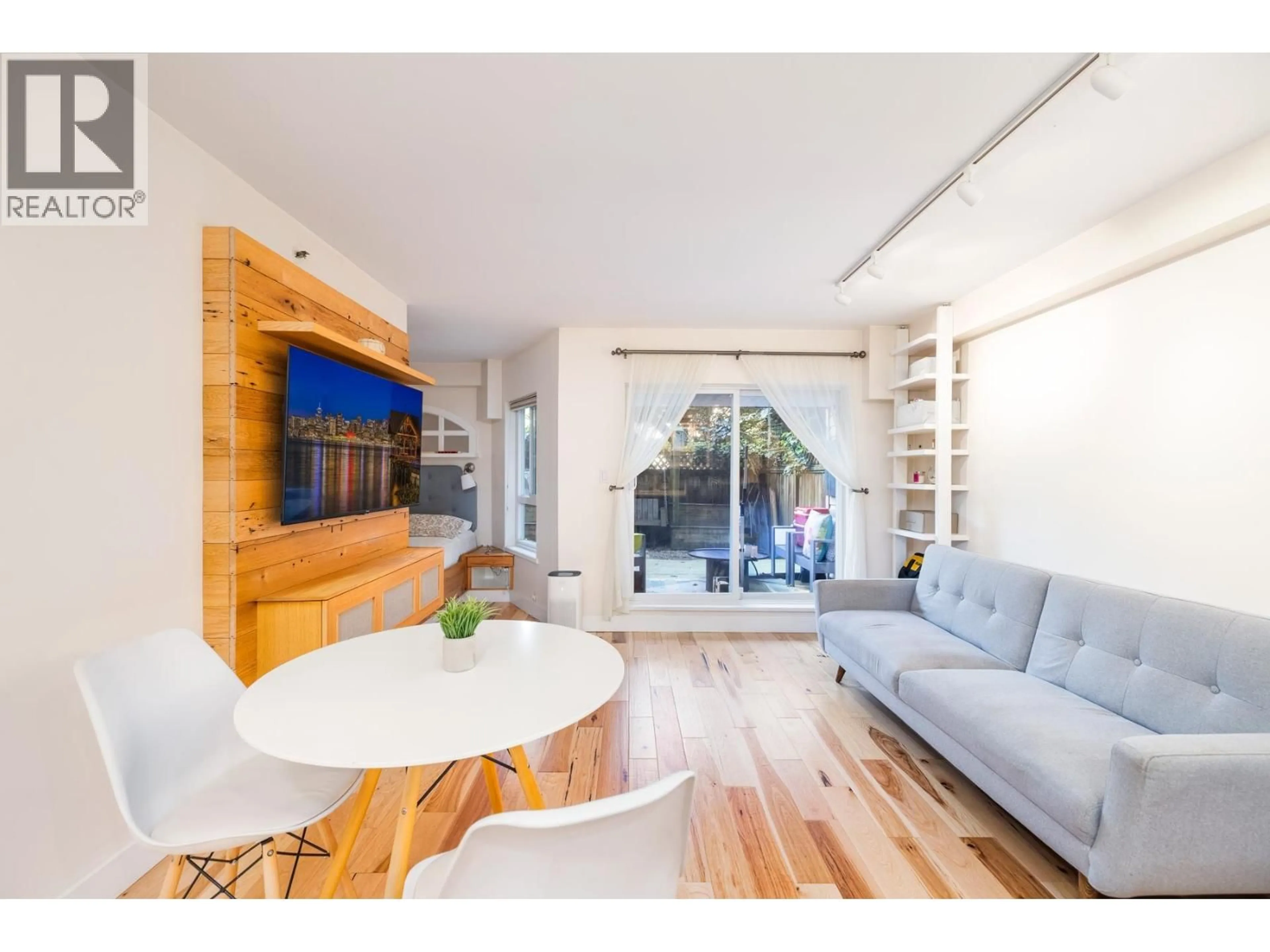 Living room with furniture, wood/laminate floor for 112 - 825 7TH AVENUE, Vancouver British Columbia V5T1P4