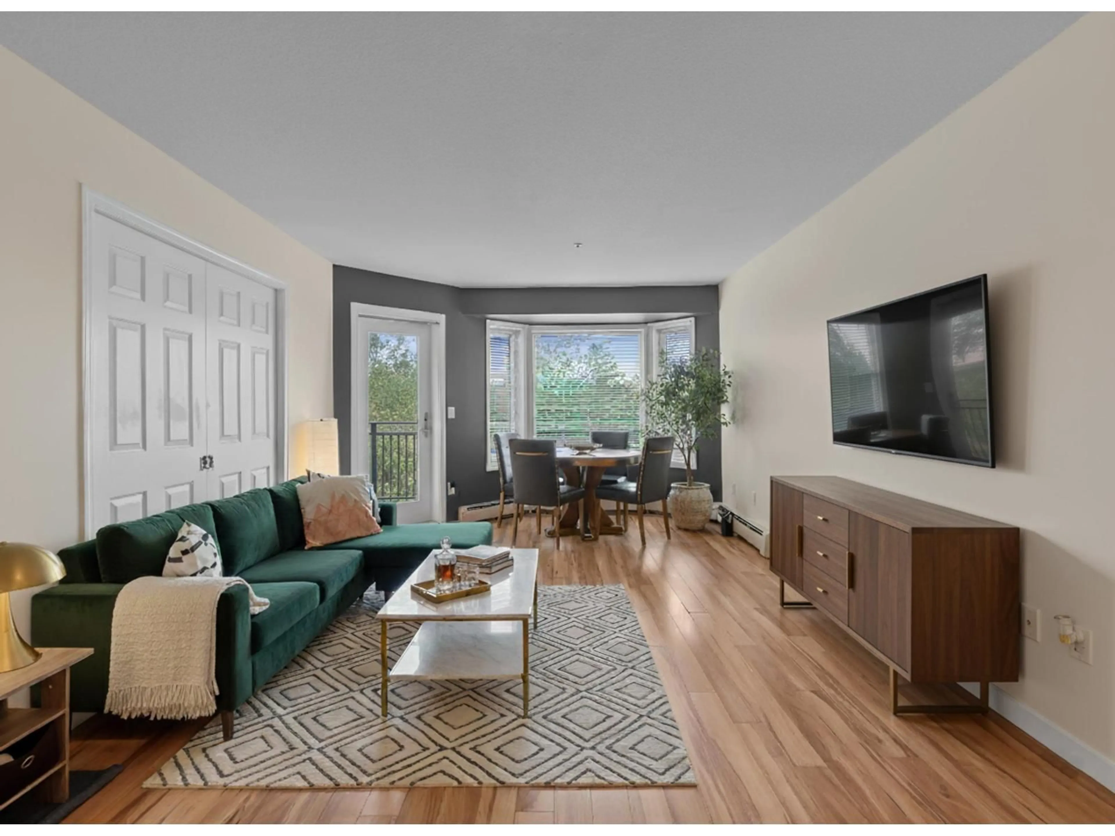 Living room with furniture, wood/laminate floor for 311 - 2700 MCCALLUM ROAD, Abbotsford British Columbia V2S6X9