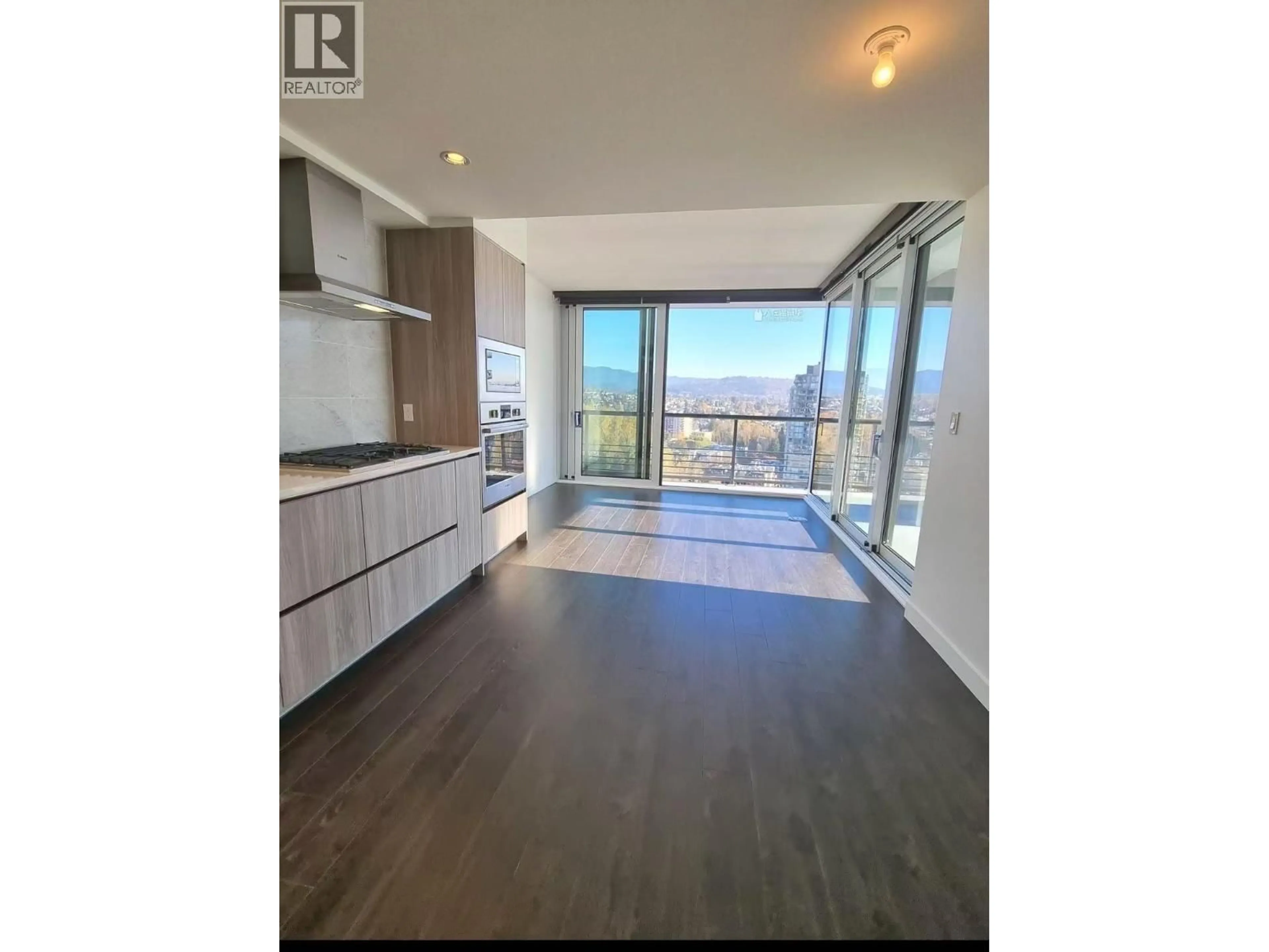 Open concept kitchen, wood/laminate floor for 1409 - 4720 LOUGHEED HIGHWAY, Burnaby British Columbia V5C0M8