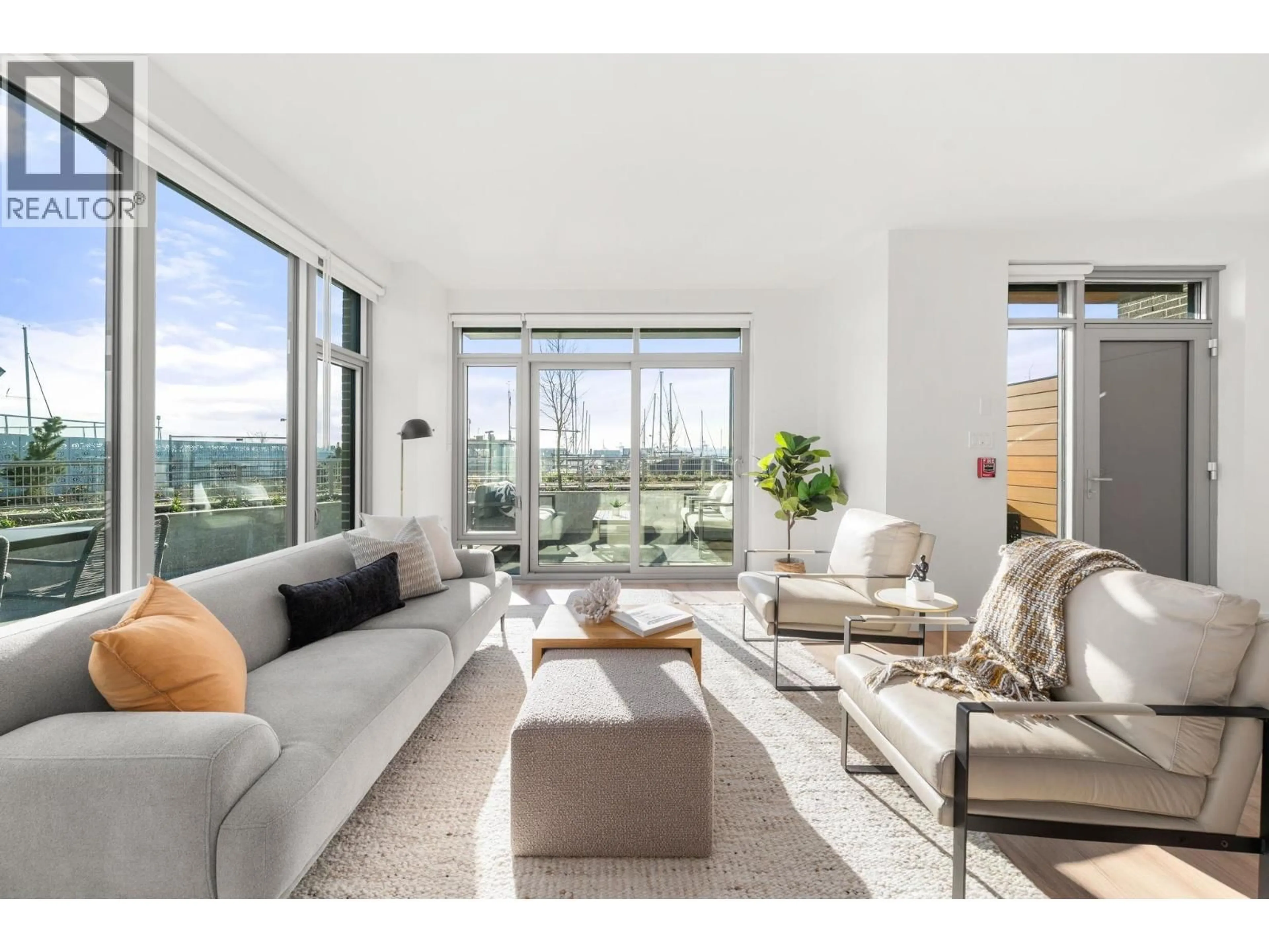 Living room with furniture, unknown for 110 - 755 HARBOURSIDE DRIVE, North Vancouver British Columbia V7P0G1