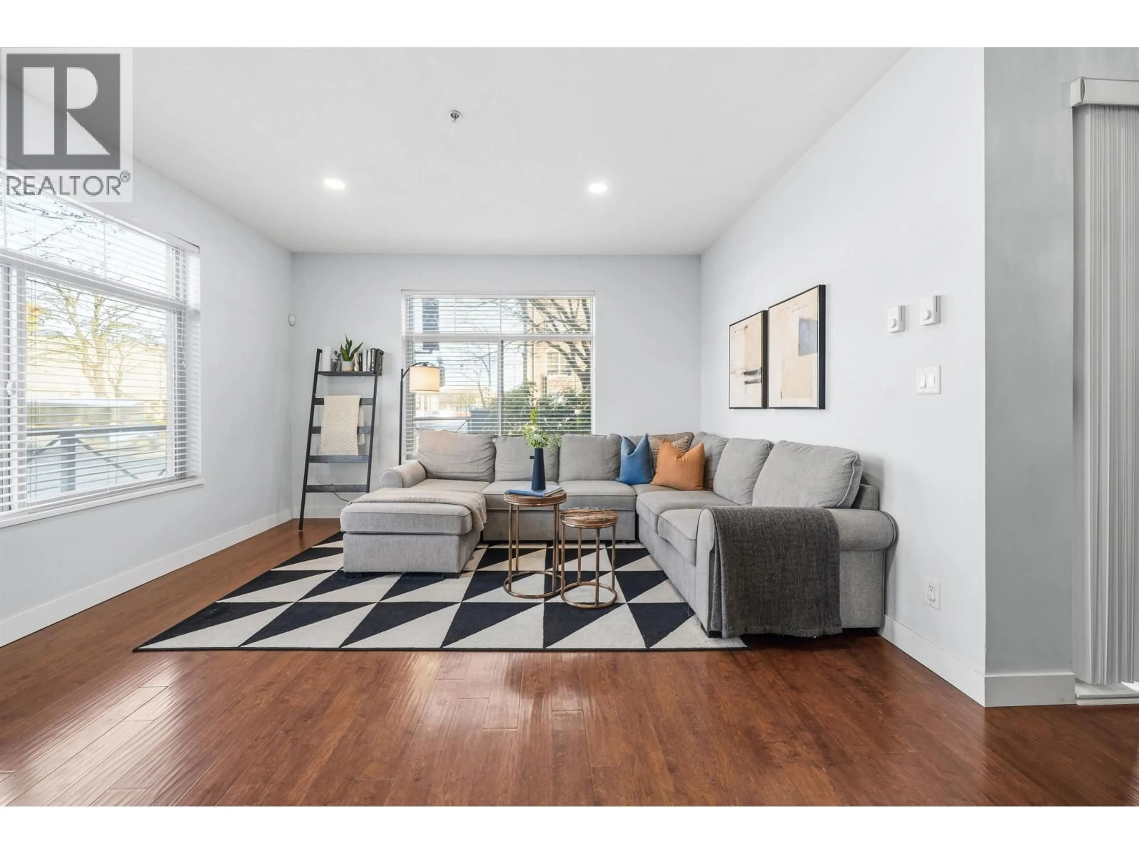 Living room with furniture, wood/laminate floor for 112 - 2330 WILSON AVENUE, Port Coquitlam British Columbia V3C1Z6