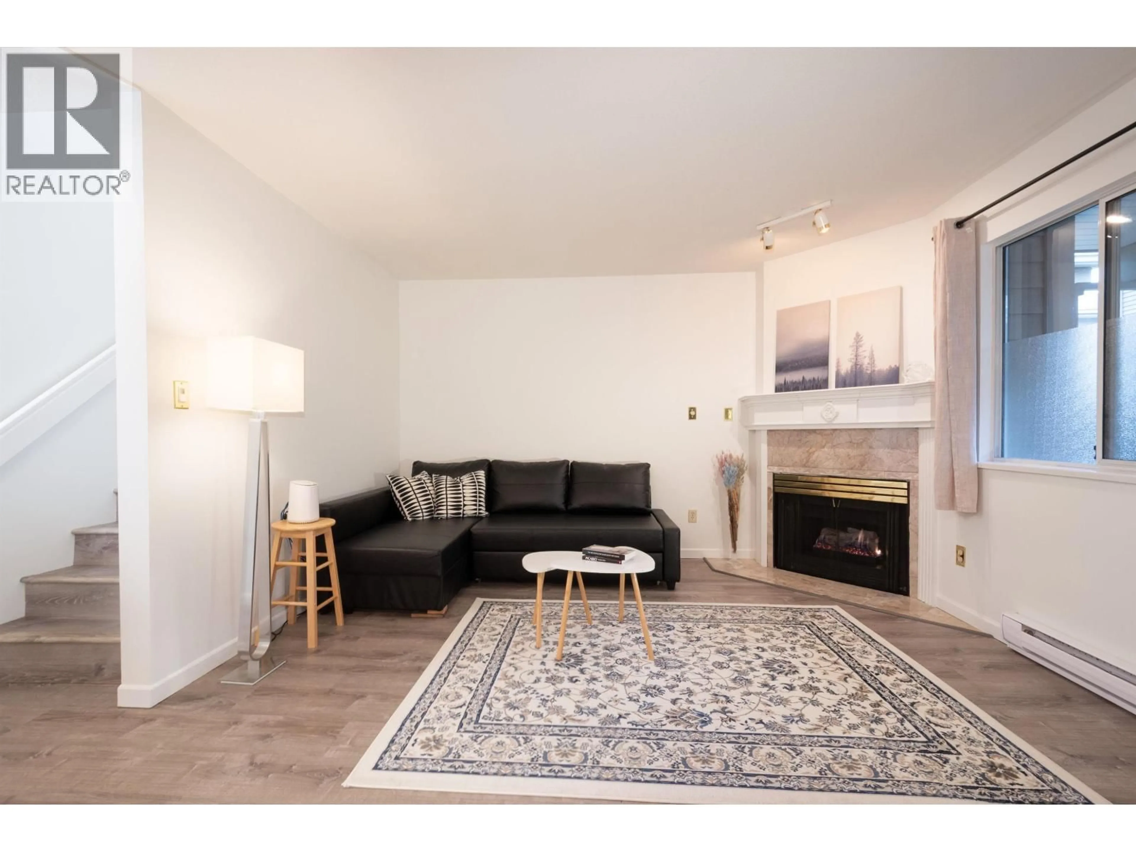 Living room with furniture, wood/laminate floor for 10 - 815 TOBRUCK AVENUE, North Vancouver British Columbia V7P1V9