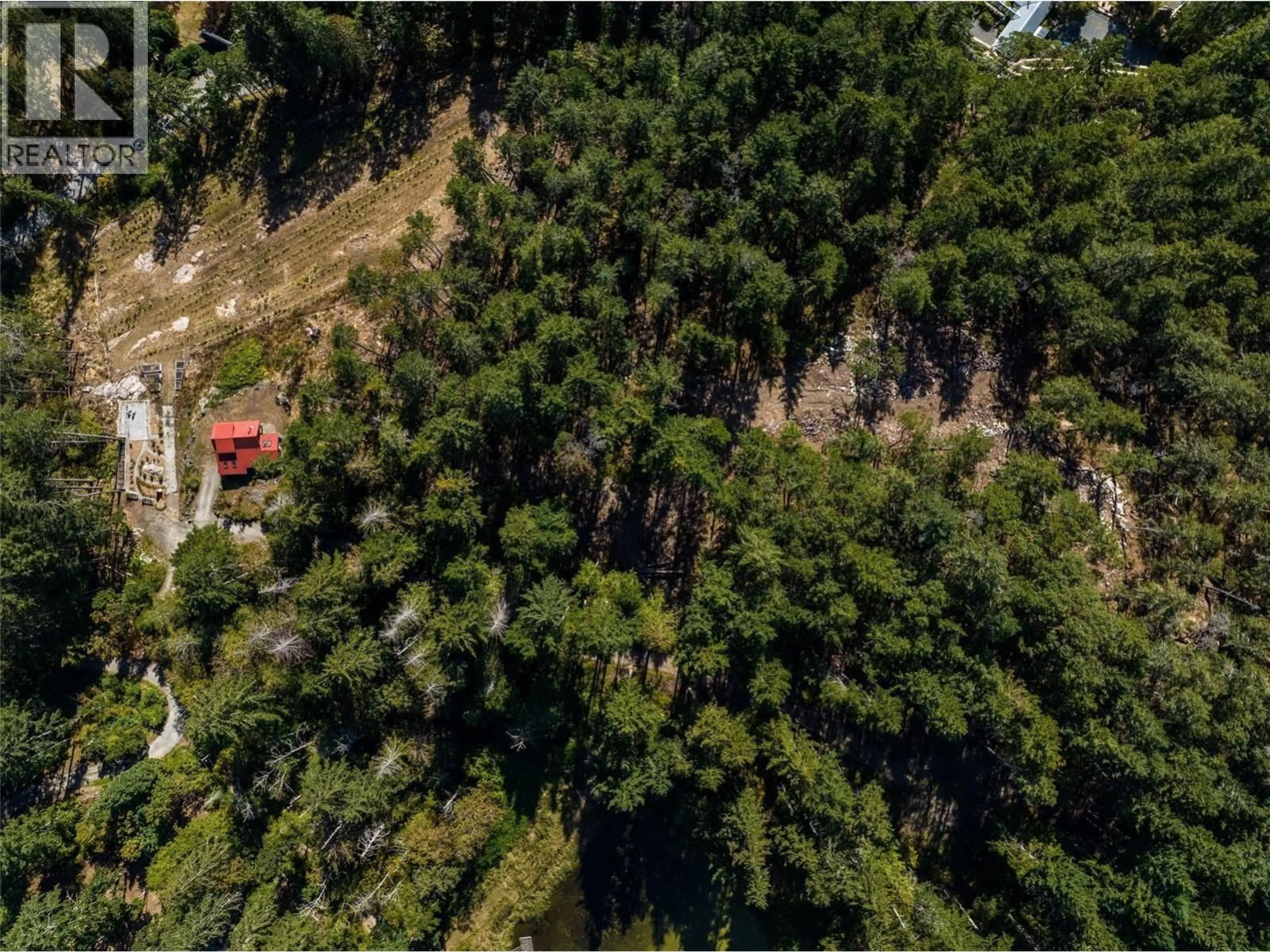 A pic from outside/outdoor area/front of a property/back of a property/a pic from drone, forest/trees view for 400 BAKER ROAD, Salt Spring Island British Columbia V8K2N5